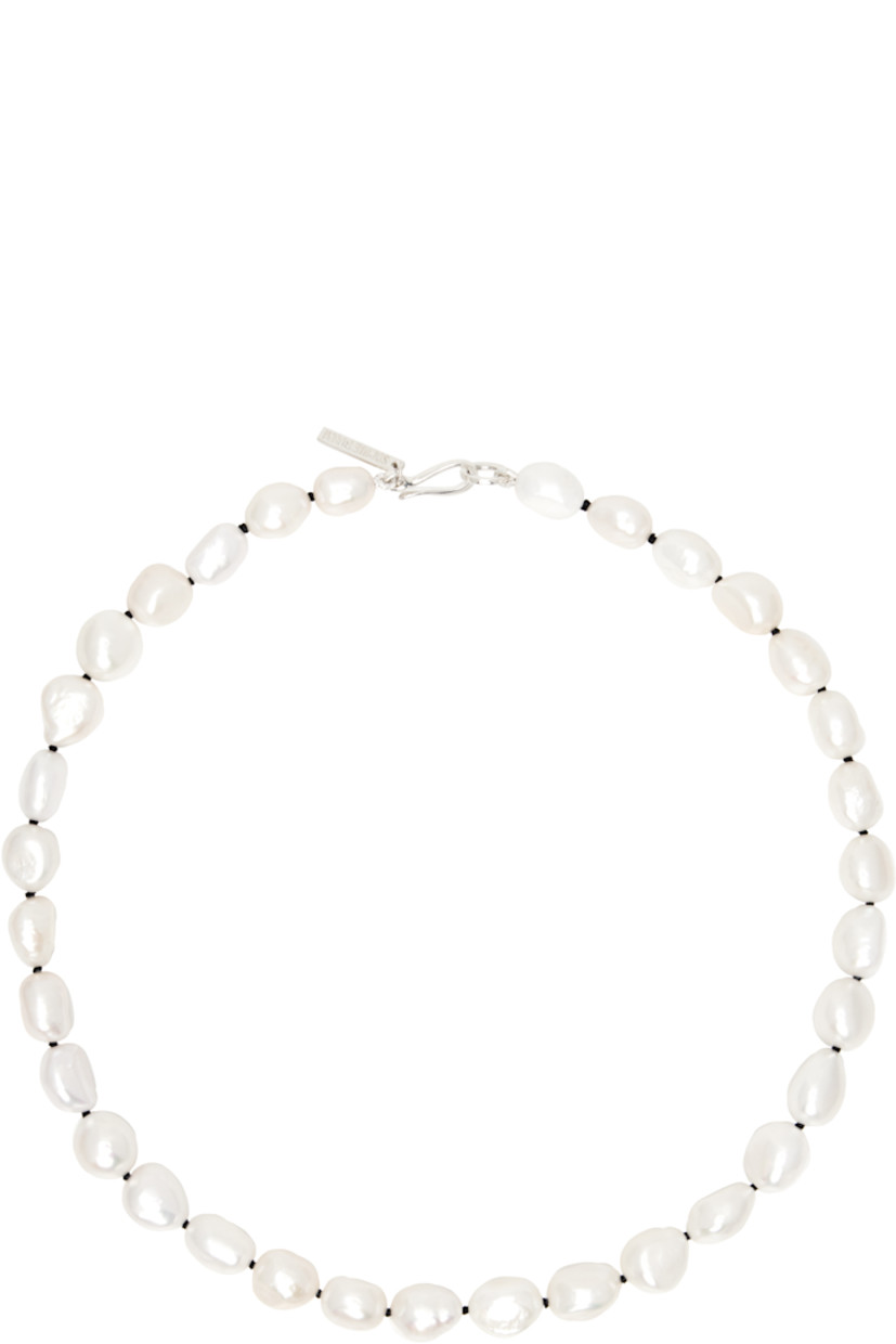 Handcrafted beaded baroque freshwater pearl necklace.

· Logo plaque at hook-eye fastening
· Sterling silver hardware
· L16"

Supplier color: Sterling silver