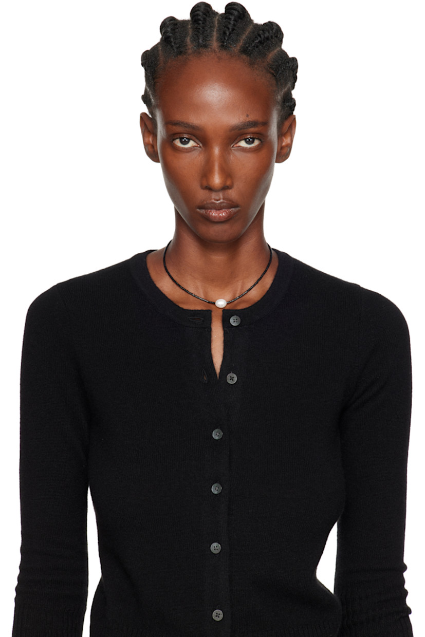 Handcrafted beaded black agate seed choker.

· Freshwater pearl at face
· Logo plaque at hook-eye fastening 
· Sterling silver hardware 
· L14.5"

Supplier color: Pearl