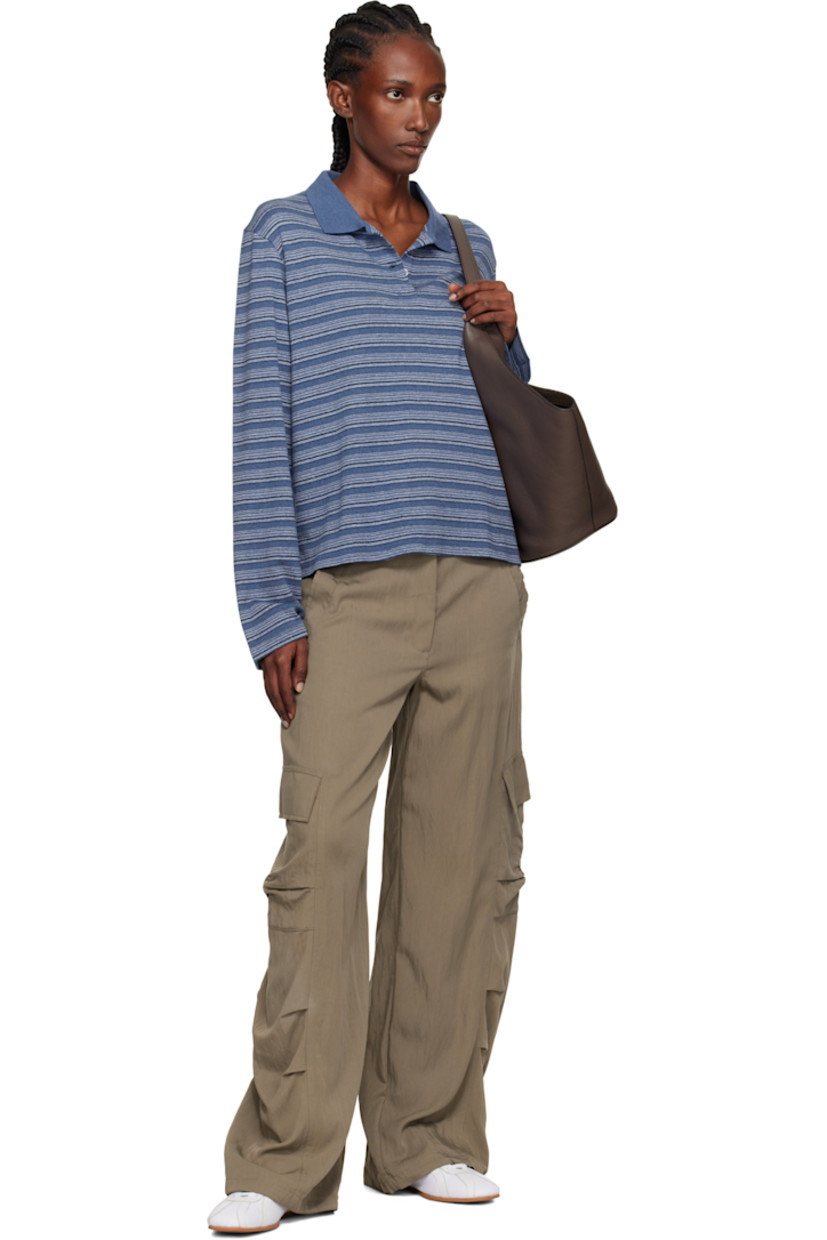 Knit organic cotton-blend polo.

· GOTS-certified organic cotton
· Stripe pattern throughout
· Rib-knit spread collar
· Two-button placket
· Dropped shoulders

Supplier color: Blue Stripe