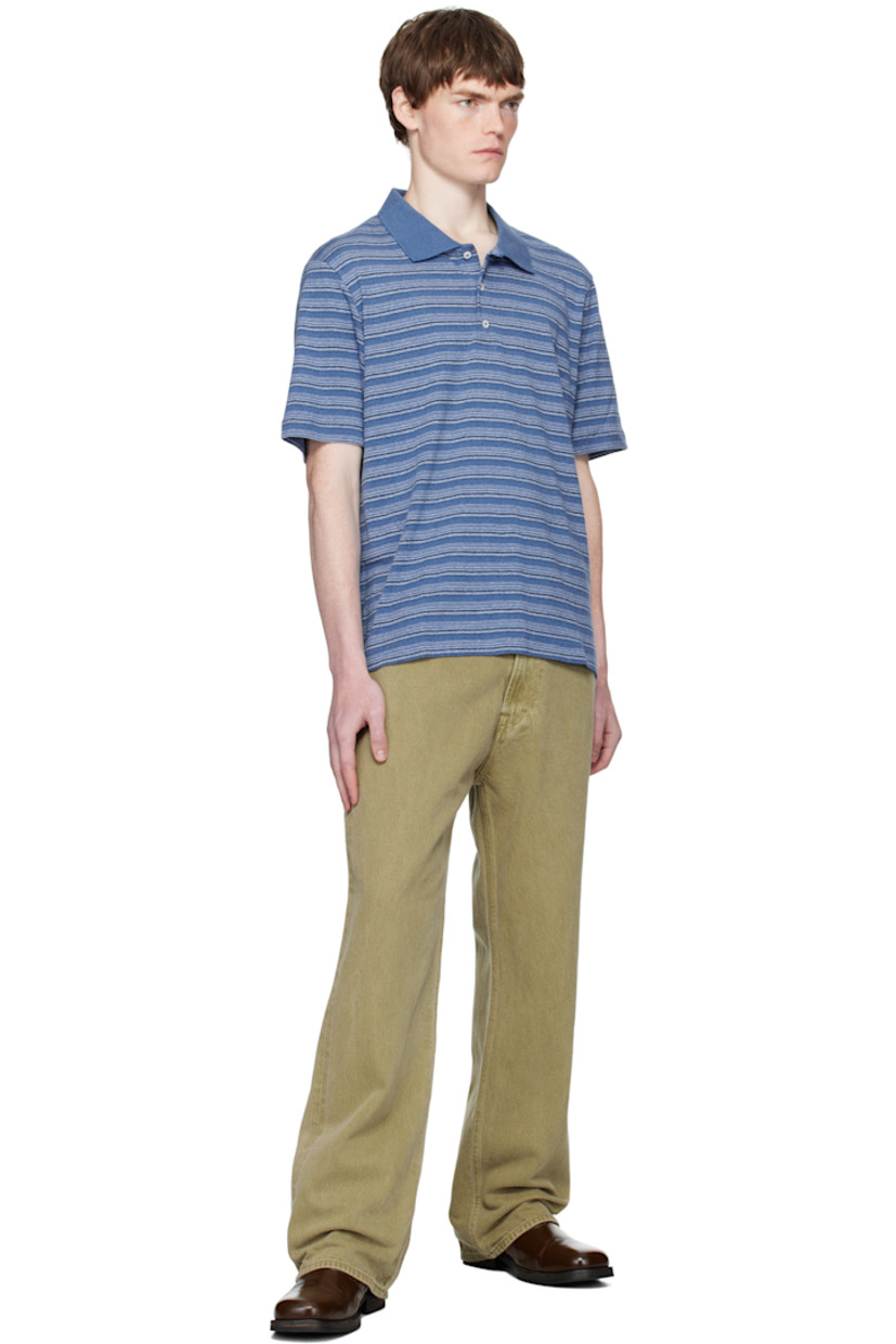 Cotton piqué polo.

· Stripe pattern throughout
· Rib-knit spread collar
· Two-button placket
· Dropped shoulders

Supplier color: Blue Stripe