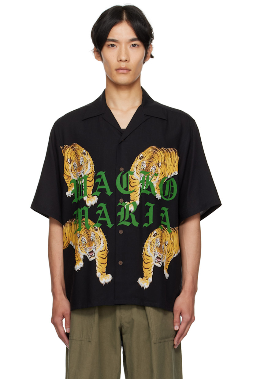 Tencel poplin shirt.

· Graphic pattern printed throughout
· Open spread collar
· Button closure
· Logo and graphics printed at front
· Patch pocket at chest
· Pleats at back yoke
· Logo embroidered at back

Featuring artwork by Tim Lehi.

Supplier color: Black
