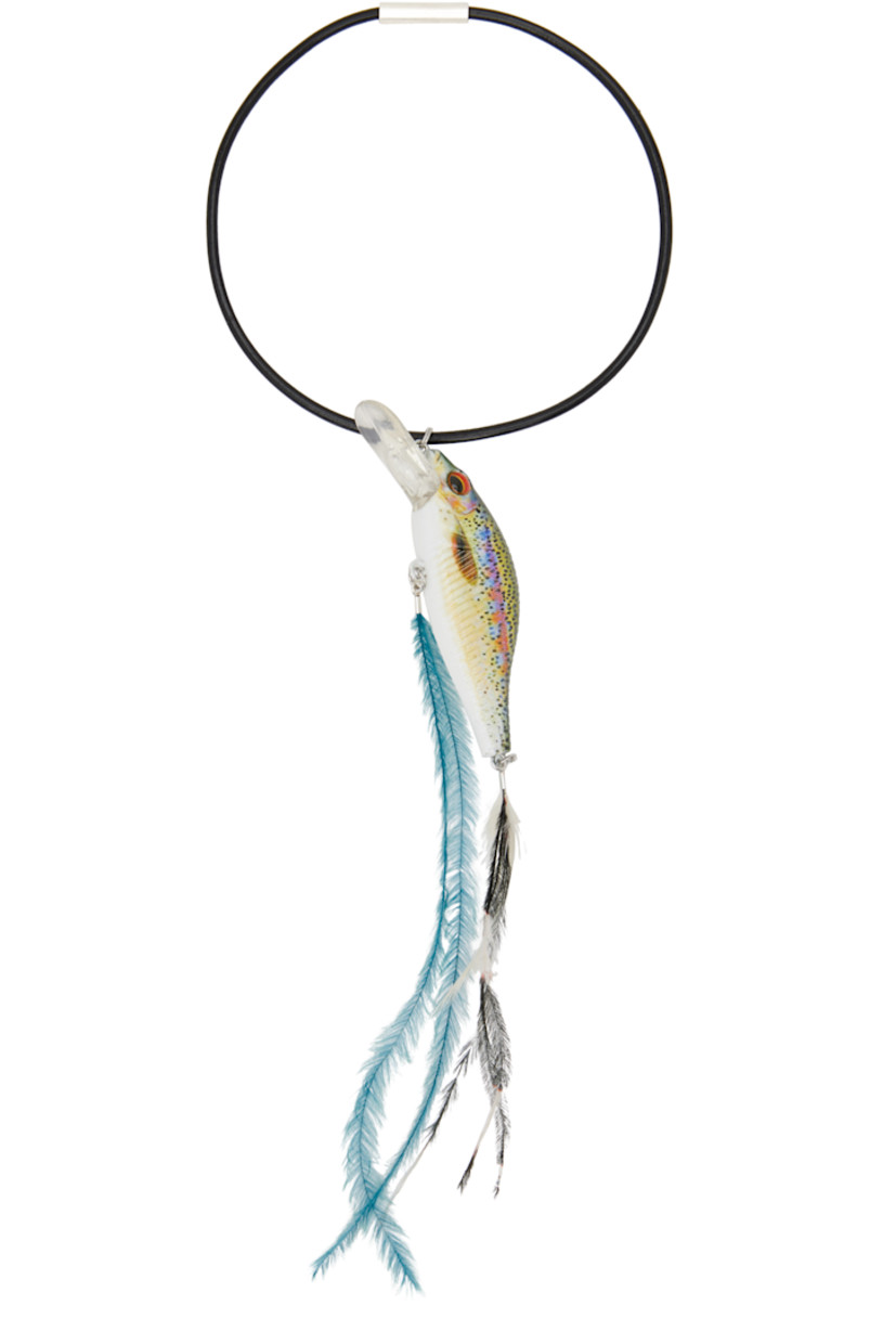 Plastic keychain in multicolor. 

· Fixed wristlet strap
· Graphic charm and feathers at drop 
· H10.5" x D4"

Supplier color: Multicolour