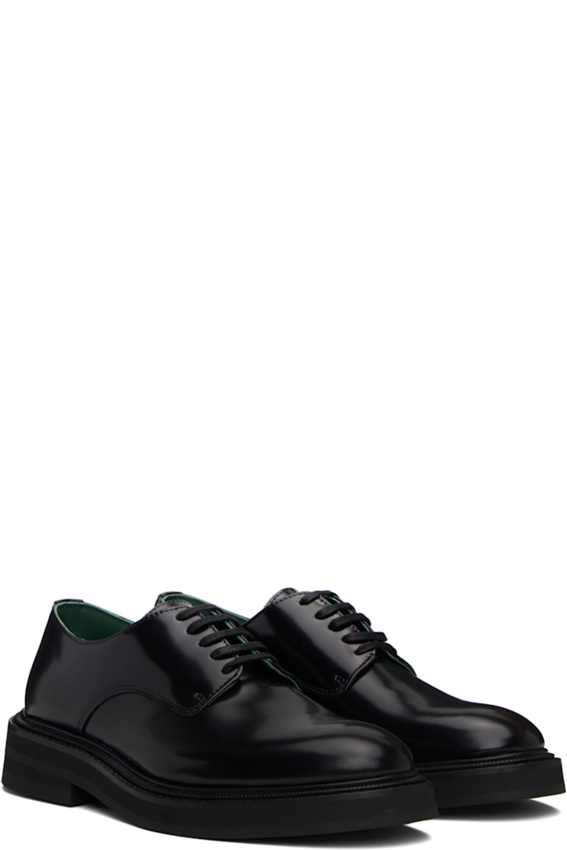 Polished leather derbys.

· Lace-up closure
· Buffed leather lining
· Topstitching at welt
· Foam rubber midsole
· Treaded rubber sole

Supplier color: Black