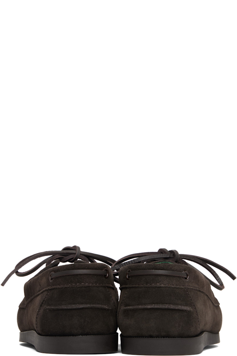 Suede boat shoes.

· Moc toe
· Lace-up closure
· Pinched seam at heel counter
· Buffed leather lining
· Treaded rubber sole

Supplier color: Dark brown