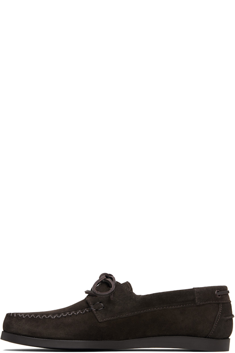 Suede boat shoes.

· Moc toe
· Lace-up closure
· Pinched seam at heel counter
· Buffed leather lining
· Treaded rubber sole

Supplier color: Dark brown