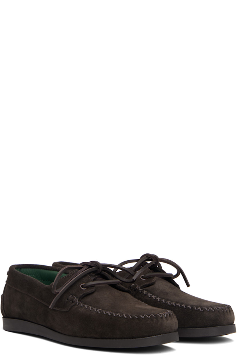 Suede boat shoes.

· Moc toe
· Lace-up closure
· Pinched seam at heel counter
· Buffed leather lining
· Treaded rubber sole

Supplier color: Dark brown