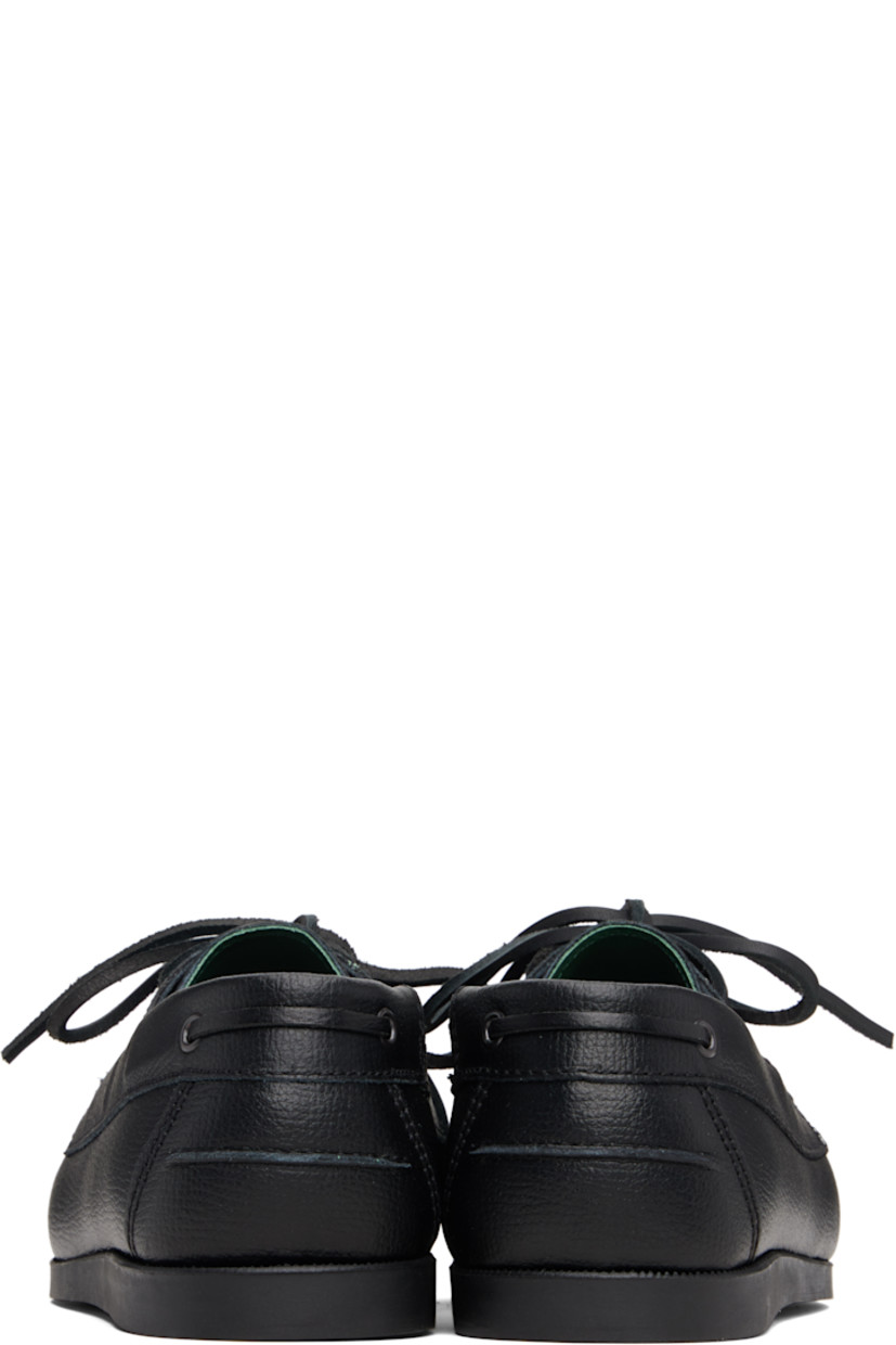 Grained leather boat shoes.

· Moc toe
· Lace-up closure
· Pinched seam at heel counter
· Buffed leather lining
· Treaded rubber sole

Supplier color: Black