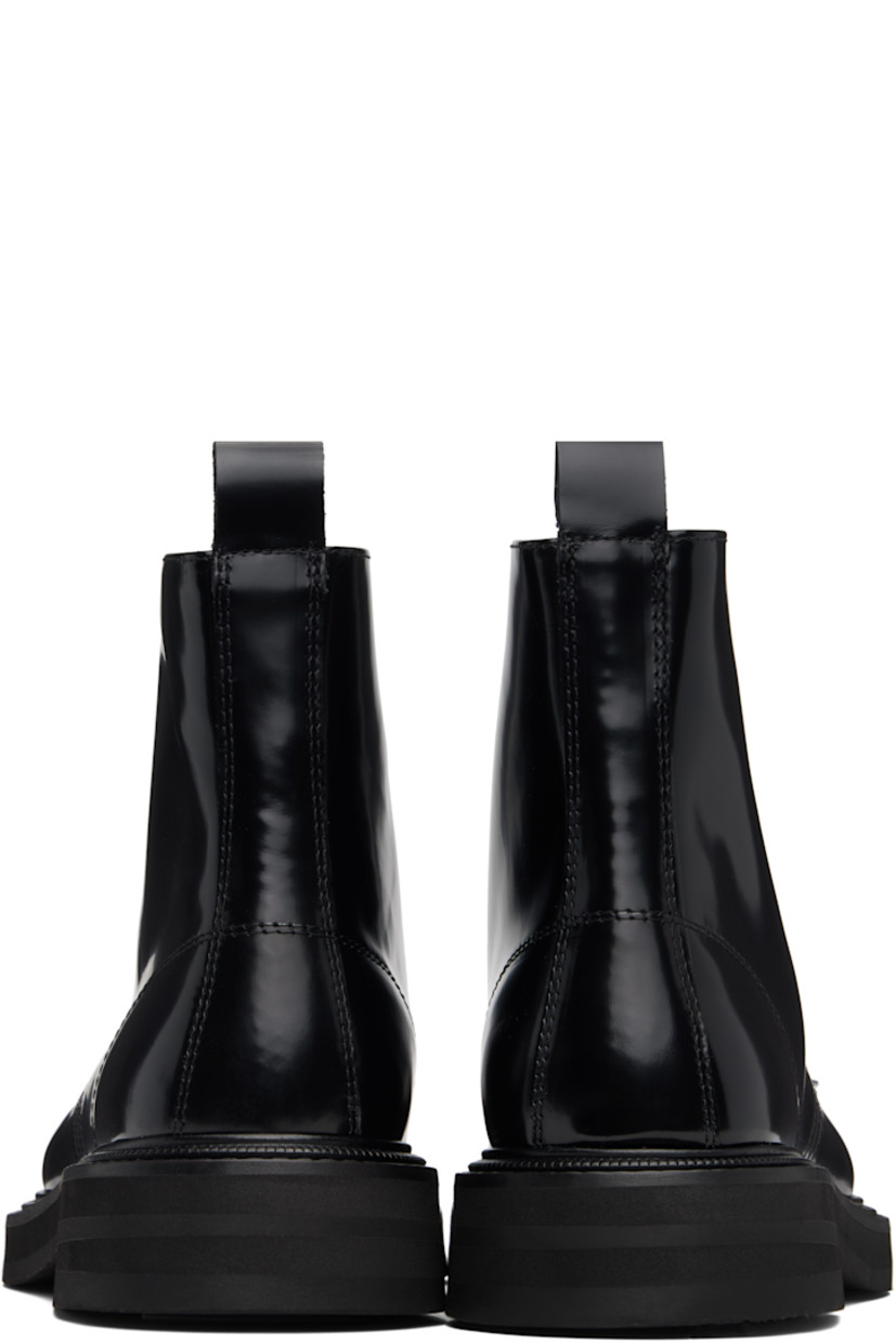Ankle-high polished leather boots.

· Lace-up closure
· Pull-loop at heel collar
· Buffed leather lining
· Topstitching at welt
· Foam rubber midsole
· Treaded rubber sole

Supplier color: Black