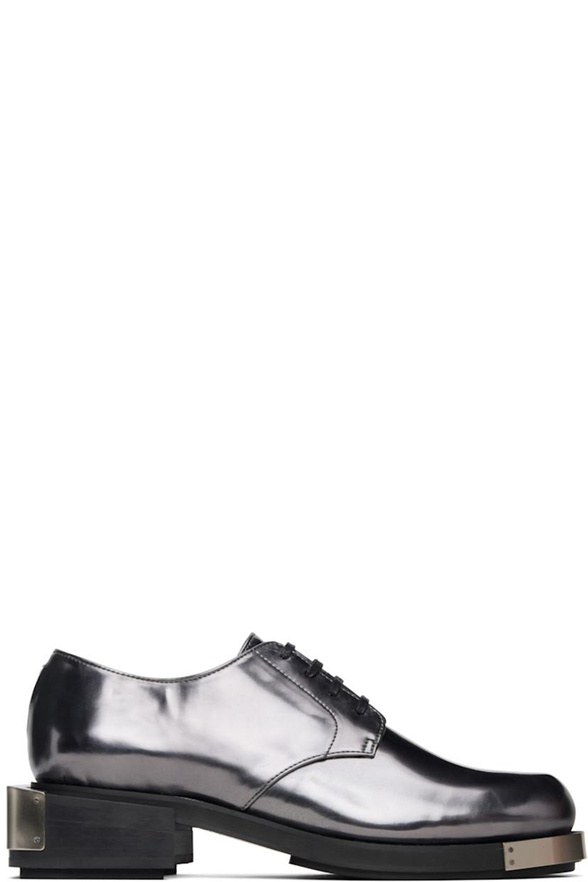 Polished faux-leather derbys.

· Logo plaque at toe and heel
· Lace-up closure
· Grained faux-leather lining
· Stacked faux-leather heel with rubber injection
· Faux-leather sole with rubber injection
· Heel: H1.75"

Supplier color: Grey