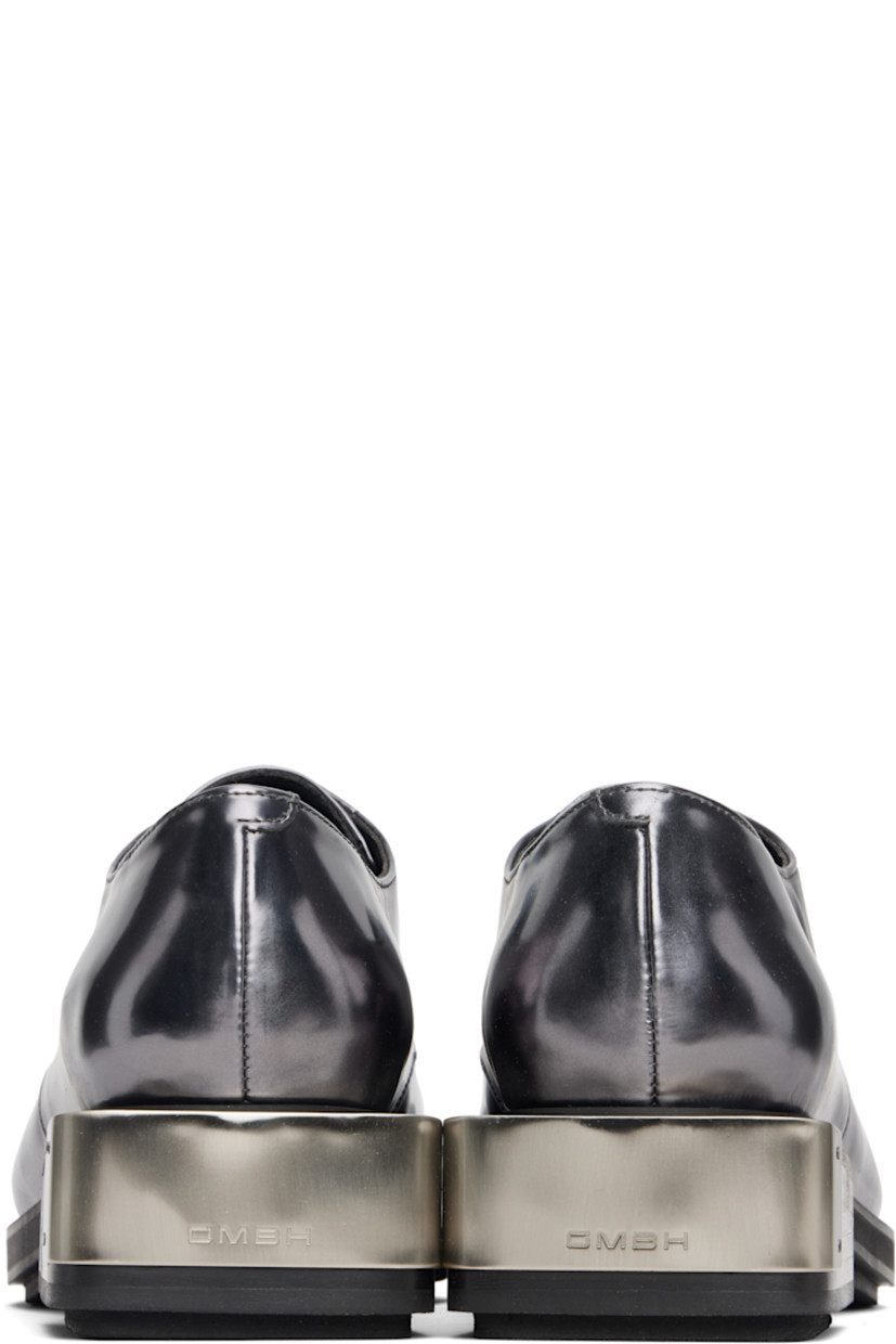 Polished faux-leather derbys.

· Logo plaque at toe and heel
· Lace-up closure
· Grained faux-leather lining
· Stacked faux-leather heel with rubber injection
· Faux-leather sole with rubber injection
· Heel: H1.75"

Supplier color: Grey