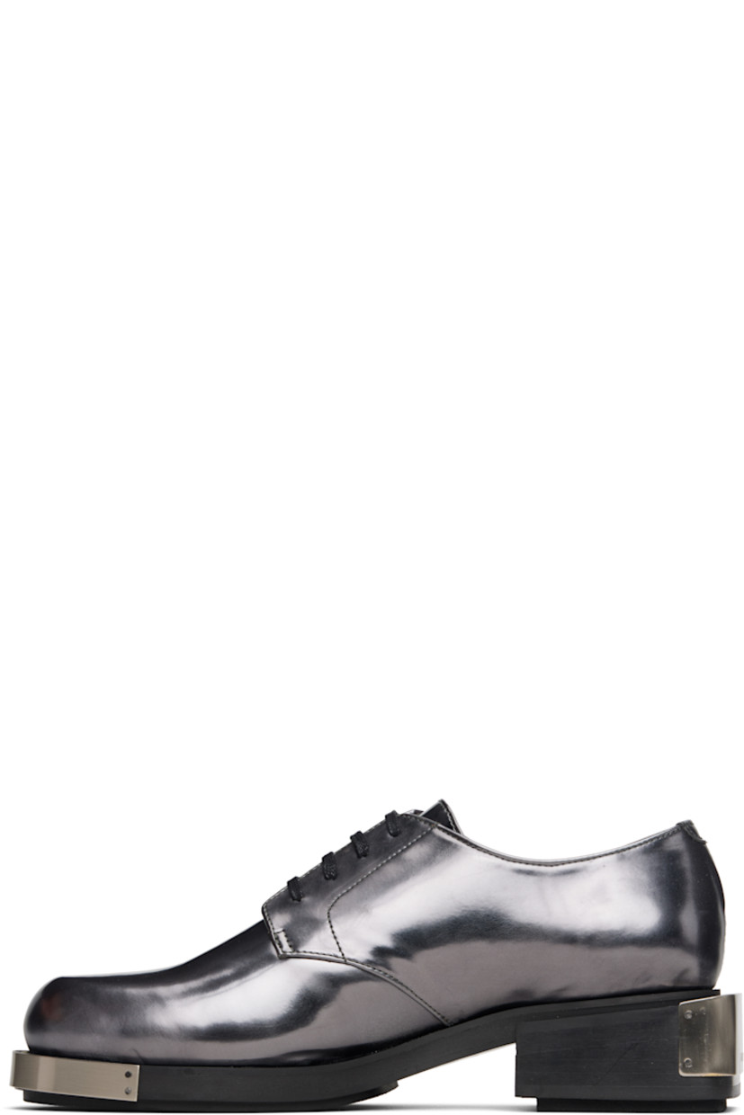 Polished faux-leather derbys.

· Logo plaque at toe and heel
· Lace-up closure
· Grained faux-leather lining
· Stacked faux-leather heel with rubber injection
· Faux-leather sole with rubber injection
· Heel: H1.75"

Supplier color: Grey