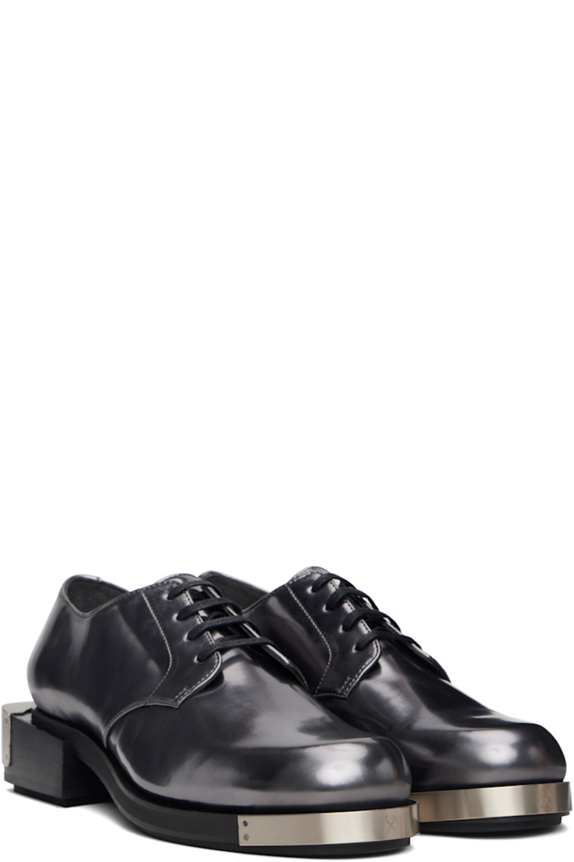 Polished faux-leather derbys.

· Logo plaque at toe and heel
· Lace-up closure
· Grained faux-leather lining
· Stacked faux-leather heel with rubber injection
· Faux-leather sole with rubber injection
· Heel: H1.75"

Supplier color: Grey