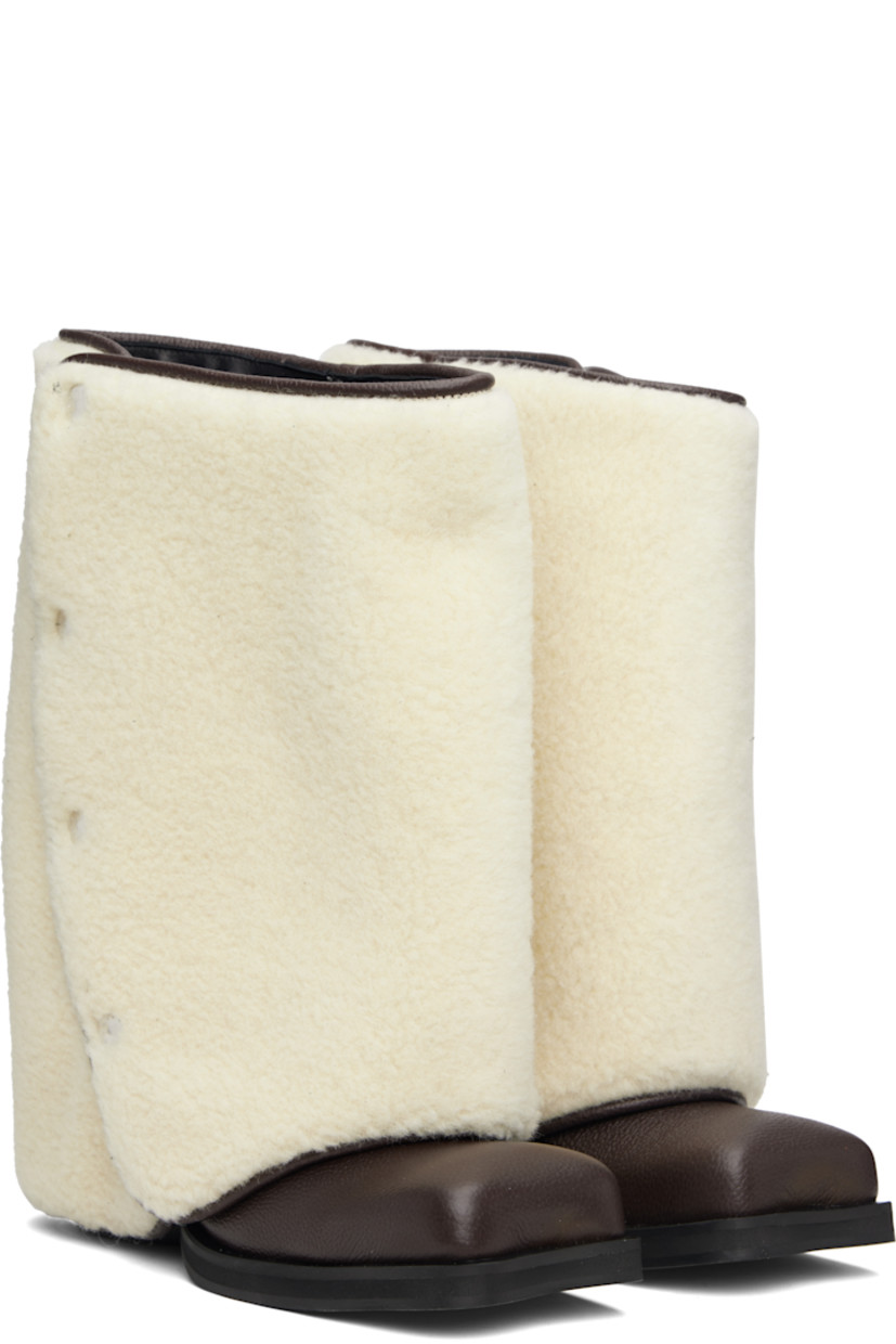 Mid-calf grained leather boots.

· Detachable wool fleece overlay
· Square toe
· Elasticized gusset at sides
· Logo printed at outer side
· Buffed leather lining
· Stacked leather heel with rubber injection
· Leather sole
· Heel: H2.75"

Supplier color: Brown