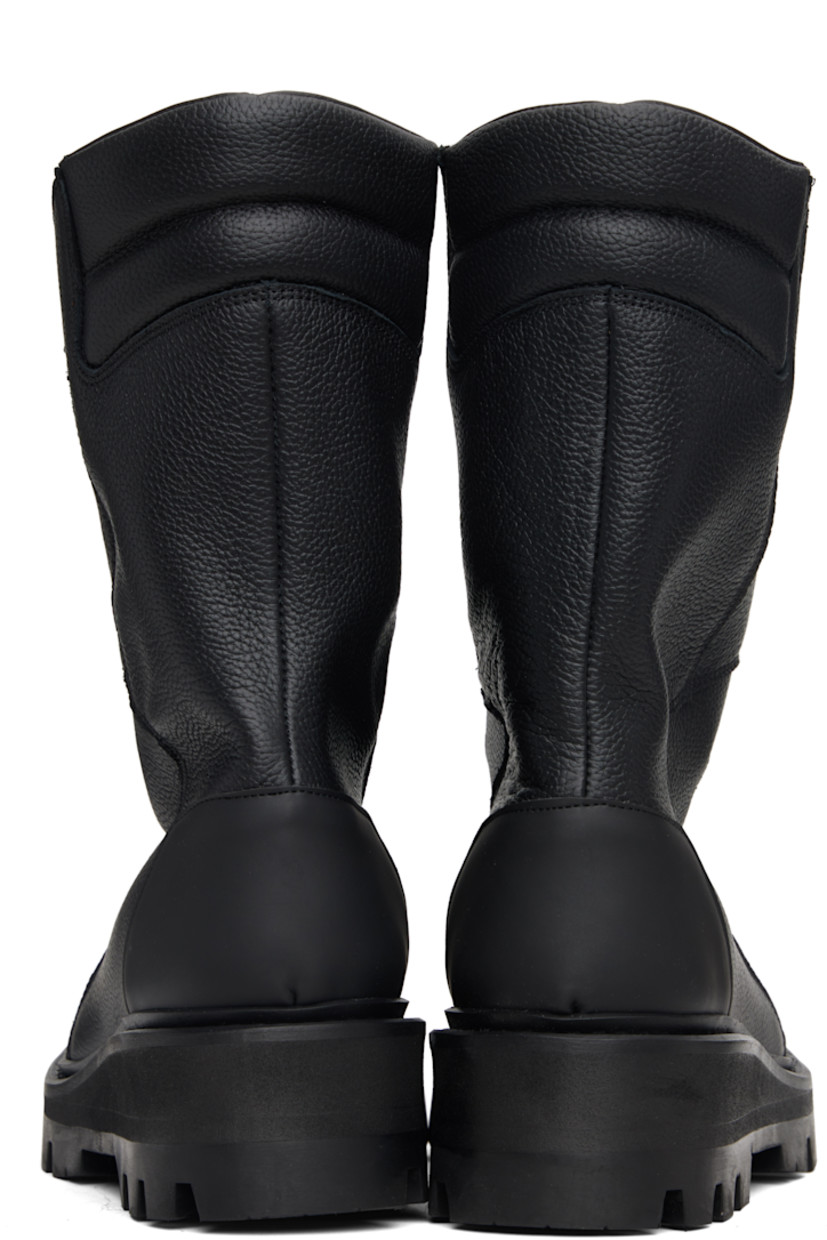 Mid-calf grained leather boots.

· Paneled construction
· Logo embossed at toe
· Padded collar
· Buffed leather lining
· Foam rubber midsole
· Treaded rubber sole

Supplier color: Black