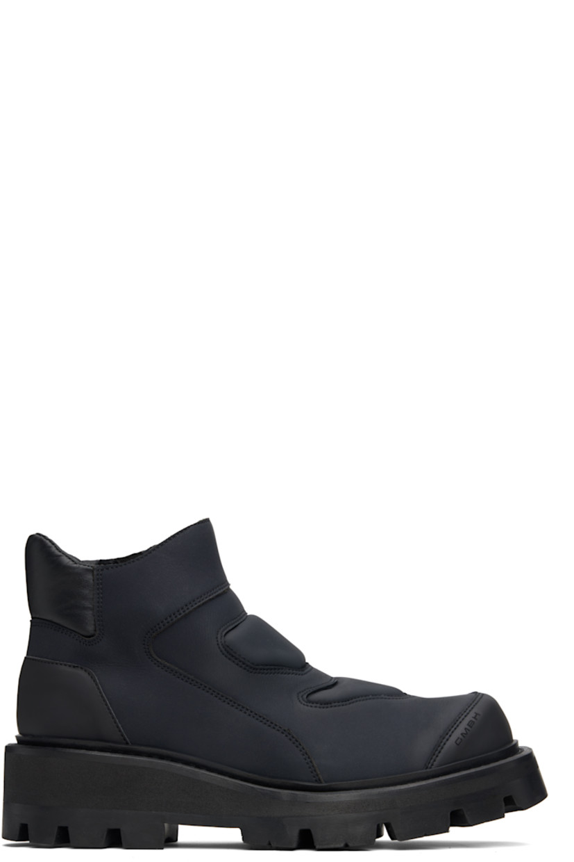 Ankle-high buffed leather boots.

· Logo embossed at toe
· Padded collar
· Zip closure at inner side
· Foam rubber midsole
· Treaded rubber sole

Supplier color: Black