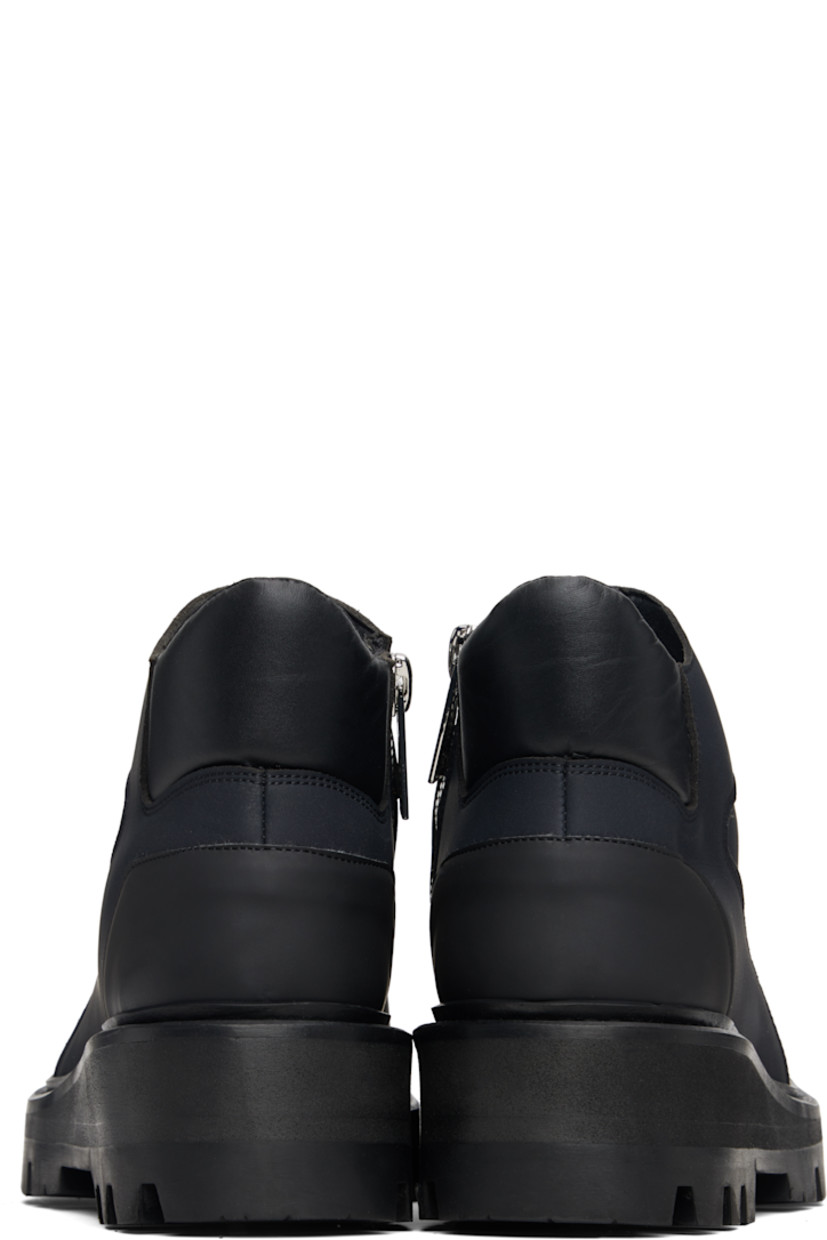 Ankle-high buffed leather boots.

· Logo embossed at toe
· Padded collar
· Zip closure at inner side
· Foam rubber midsole
· Treaded rubber sole

Supplier color: Black