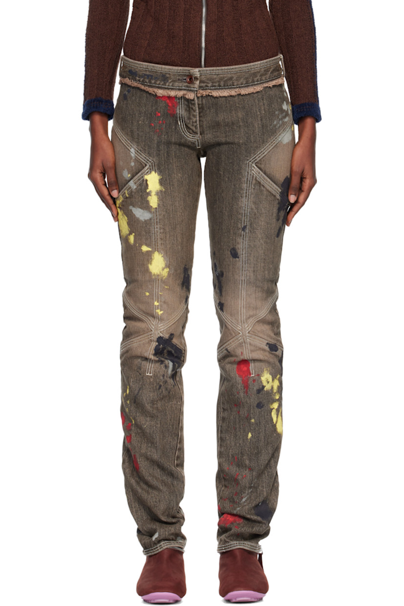 Non-stretch denim jeans.

· Fading and hand-painted detailing throughout 
· Slim-fit 
· Low-rise
· Belt loops
· Four-pocket styling
· Zip fly 
· Frayed edge at front and back waist
· Darts at legs
· Contrast stitching in white 

Supplier color: Washed brown