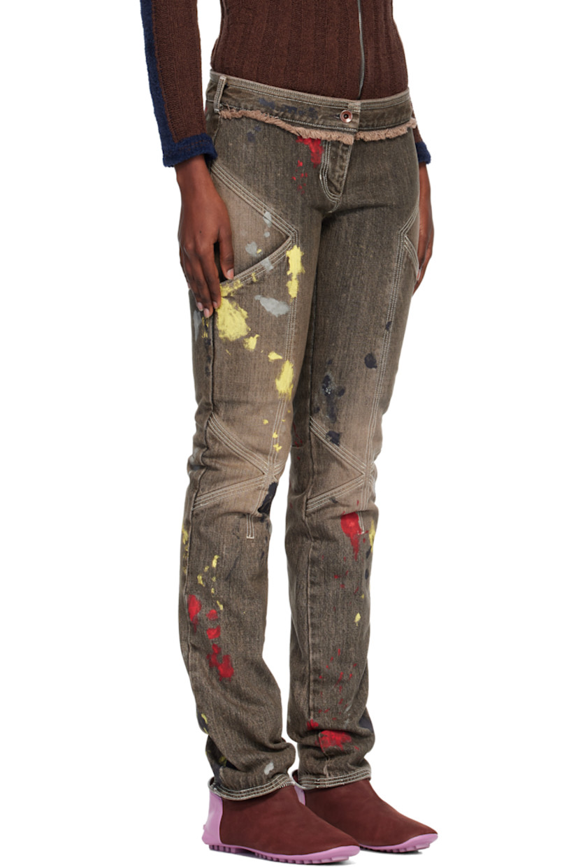 Non-stretch denim jeans.

· Fading and hand-painted detailing throughout 
· Slim-fit 
· Low-rise
· Belt loops
· Four-pocket styling
· Zip fly 
· Frayed edge at front and back waist
· Darts at legs
· Contrast stitching in white 

Supplier color: Washed brown