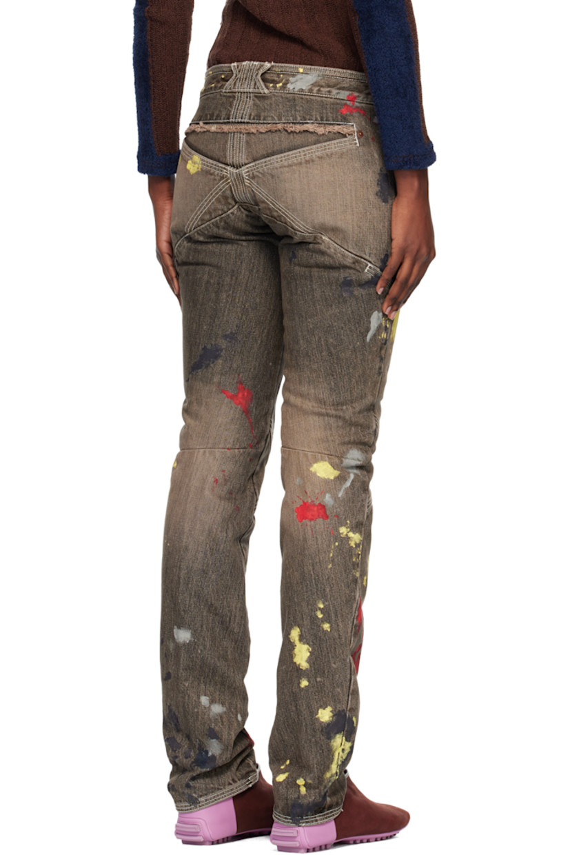 Non-stretch denim jeans.

· Fading and hand-painted detailing throughout 
· Slim-fit 
· Low-rise
· Belt loops
· Four-pocket styling
· Zip fly 
· Frayed edge at front and back waist
· Darts at legs
· Contrast stitching in white 

Supplier color: Washed brown