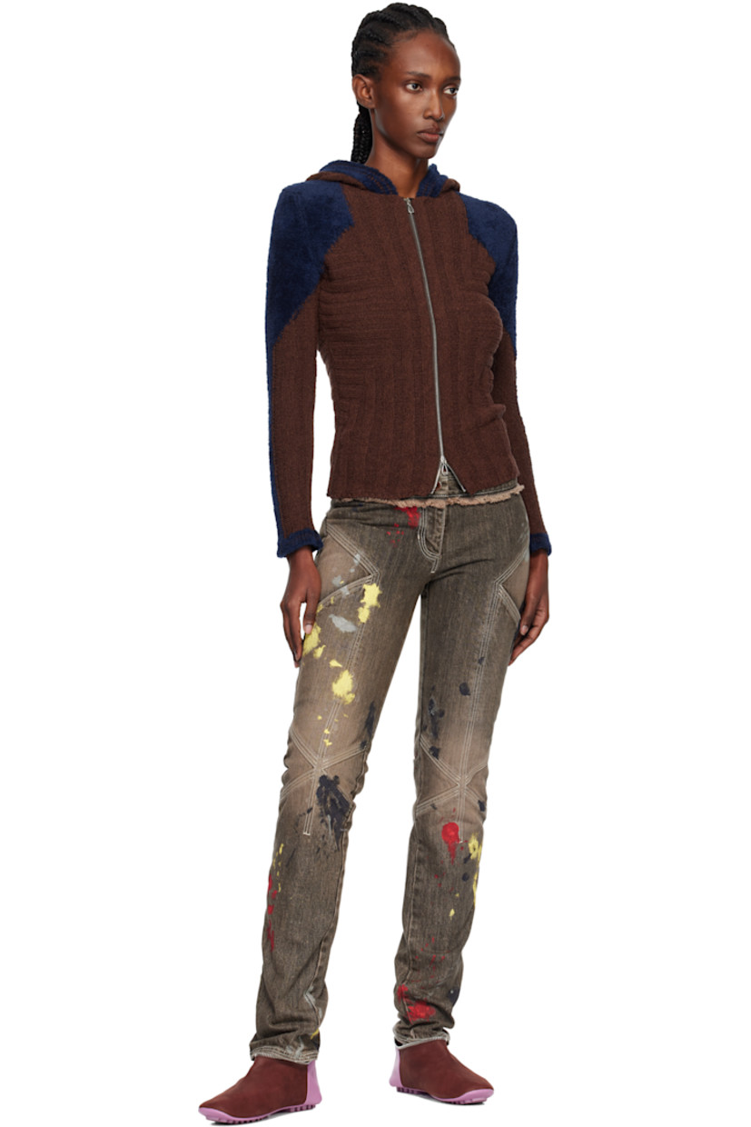 Non-stretch denim jeans.

· Fading and hand-painted detailing throughout 
· Slim-fit 
· Low-rise
· Belt loops
· Four-pocket styling
· Zip fly 
· Frayed edge at front and back waist
· Darts at legs
· Contrast stitching in white 

Supplier color: Washed brown