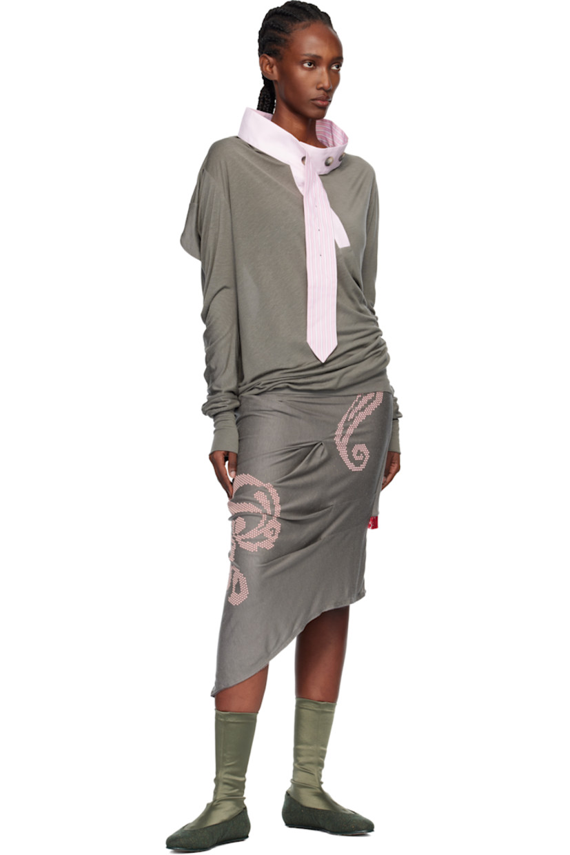 Lyocell- and silk-blend slub jersey top.

· Twisted construction 
· Round neck
· Eight-button placket 
· Rib-knit hem and cuffs

Supplier color: Gargoyle grey