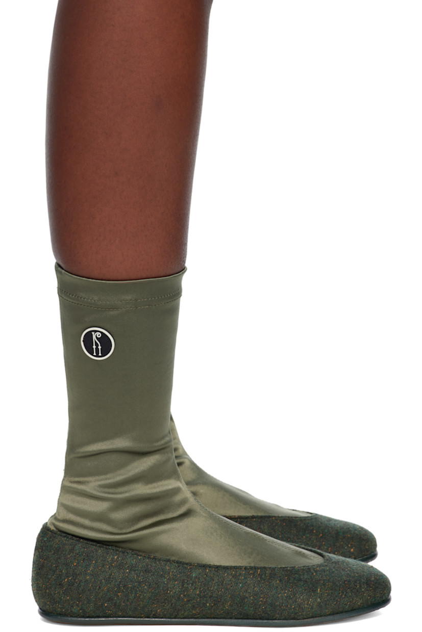 Ankle-high satin and tweed boots.

· Elasticized collar
· Rubberized logo patch at outer side
· Leather sole with rubber injection

Supplier color: Olive green