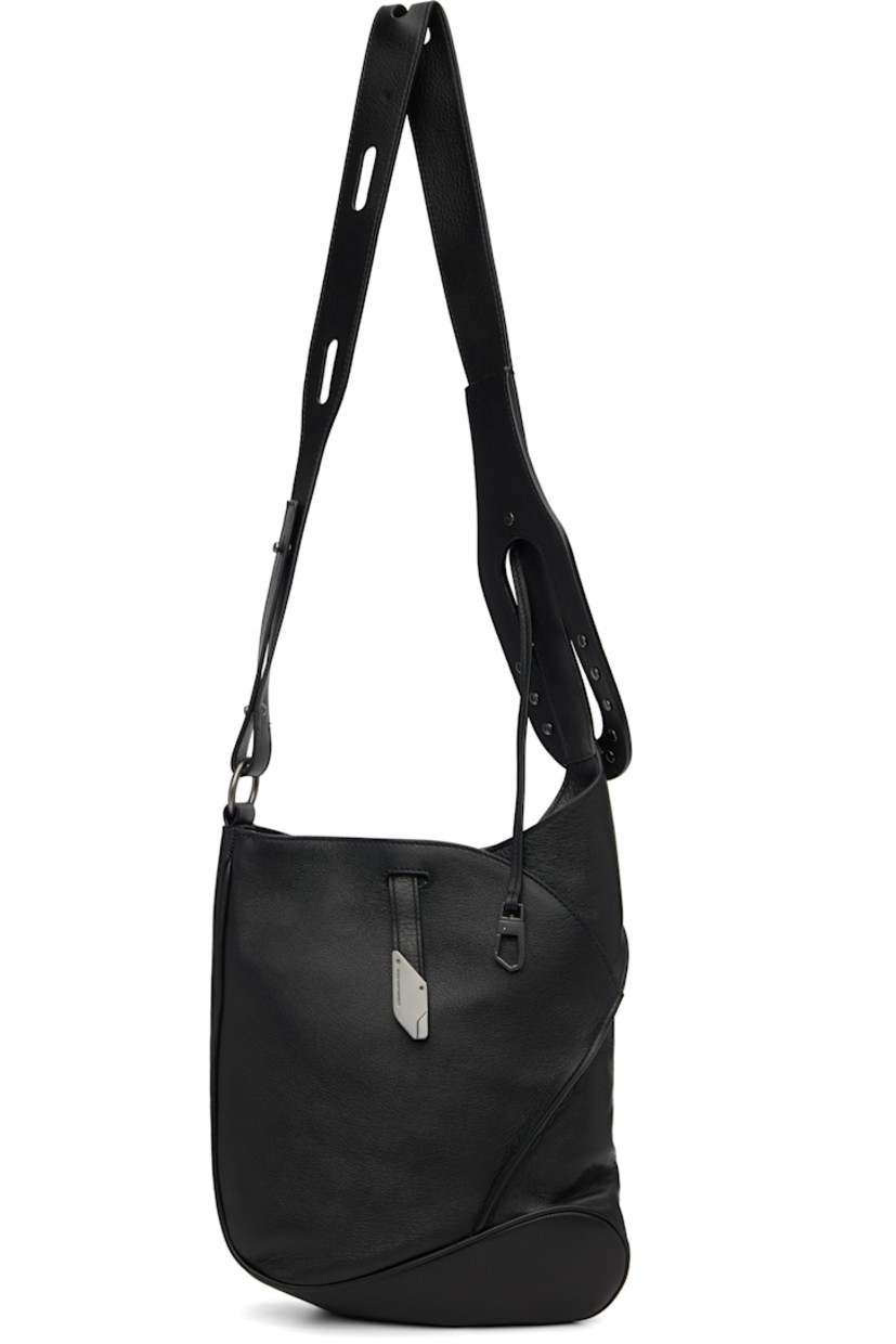 Grained nappa calfskin messenger bag.

· Clasp fastening at adjustable crossbody strap
· Pinched seam at face
· Tab-slot closure
· Zip pocket at interior
· Plain-woven lining
· H12" x W10" x D2.75"

Supplier color: Black obsidian
