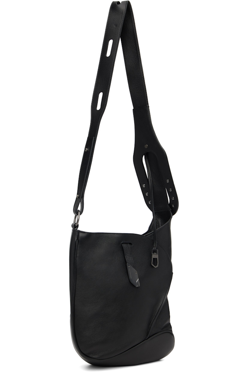 Grained nappa calfskin messenger bag.

· Clasp fastening at adjustable crossbody strap
· Pinched seam at face
· Tab-slot closure
· Zip pocket at interior
· Plain-woven lining
· H12" x W10" x D2.75"

Supplier color: Black obsidian