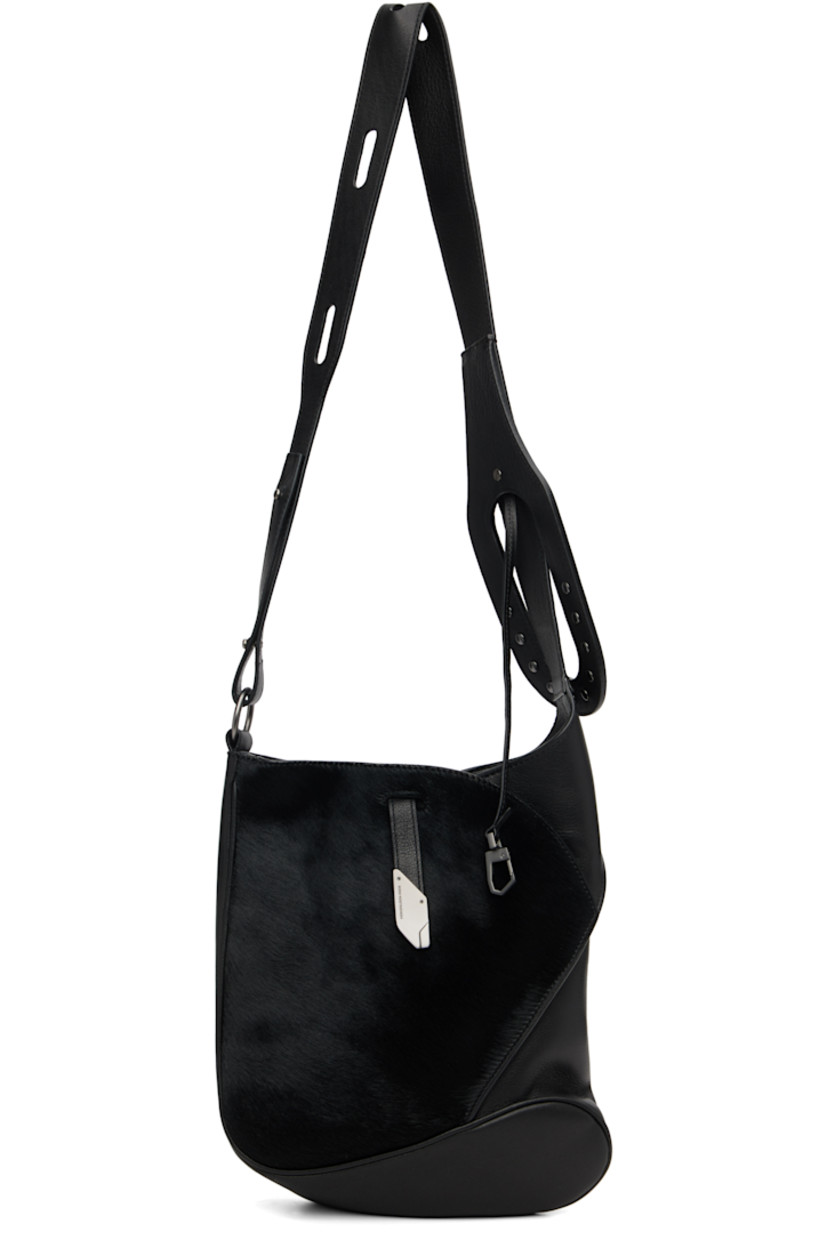 Grained nappa calfskin and hair-on-leather messenger bag.

· Clasp fastening at adjustable crossbody strap
· Pinched seam at face
· Tab-slot closure
· Zip pocket at interior
· Plain-woven lining
· H12" x W10" x D2.75"

Supplier color: Black obsidian/Pitch black