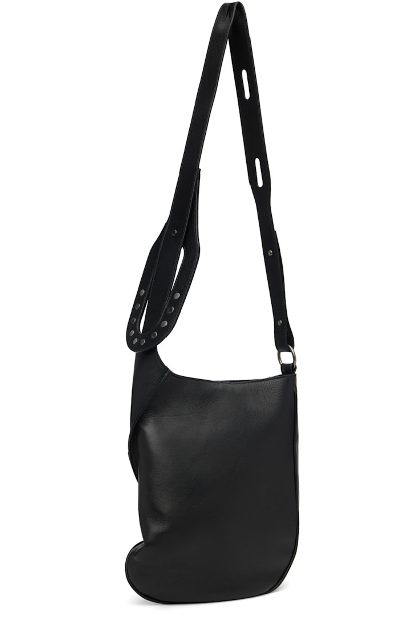 Grained nappa calfskin and hair-on-leather messenger bag.

· Clasp fastening at adjustable crossbody strap
· Pinched seam at face
· Tab-slot closure
· Zip pocket at interior
· Plain-woven lining
· H12" x W10" x D2.75"

Supplier color: Black obsidian/Pitch black