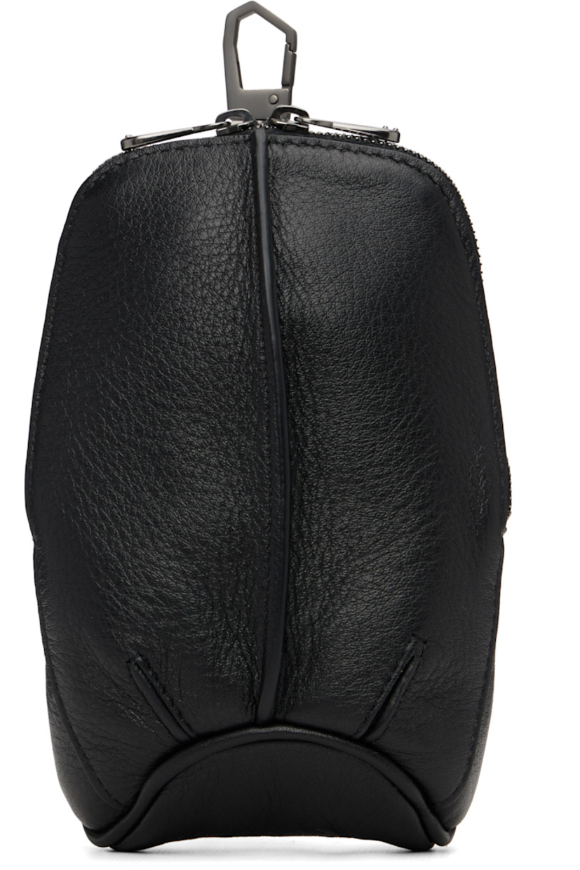 Grained nappa calfskin pouch.

· Clasp fastening at top
· Pinched seam at face
· Velcro straps at back
· Two-way zip closure
· Plain-woven lining
· H7" x W4.5" x D2"

Supplier color: Black obsidian