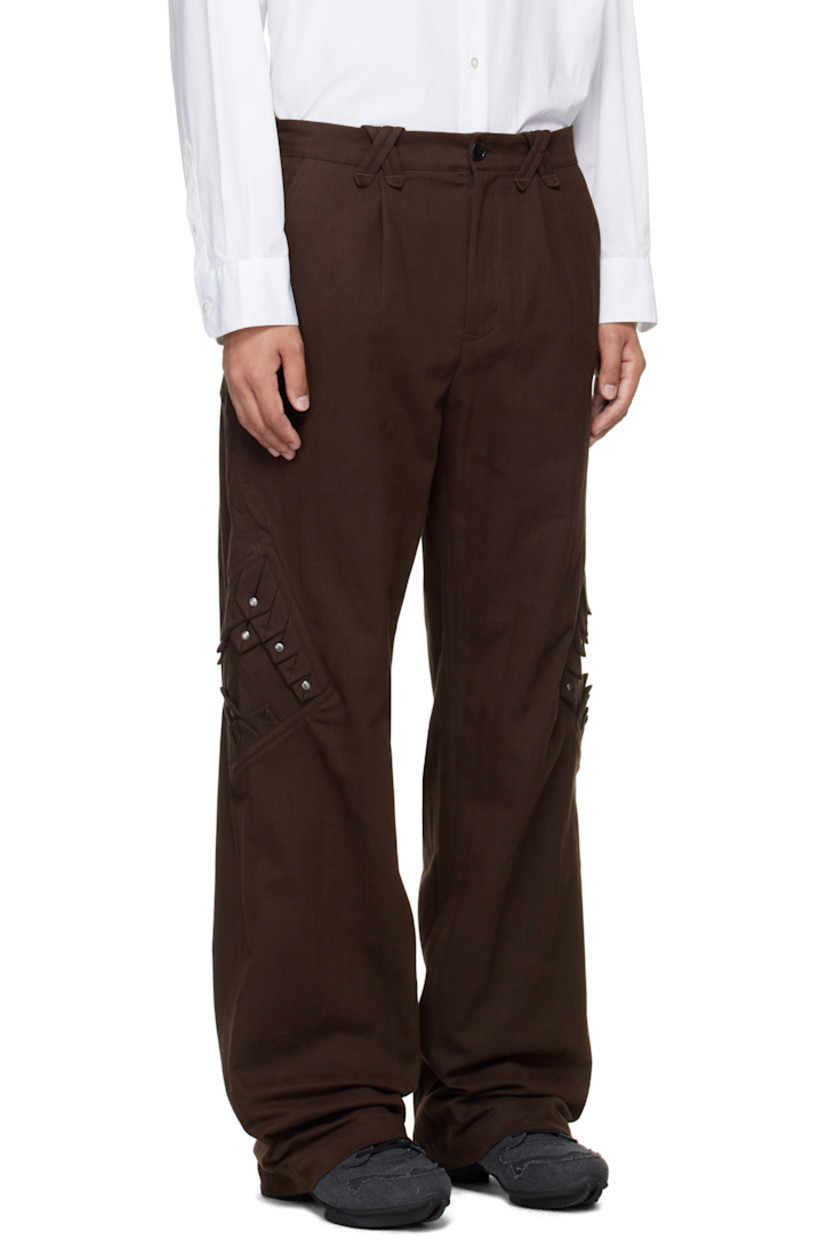 Woven stretch cotton-blend trousers.

· Belt loops
· Four-pocket styling
· Zip fly
· Pleated panel with rivets at outseams

Supplier color: Wood brown