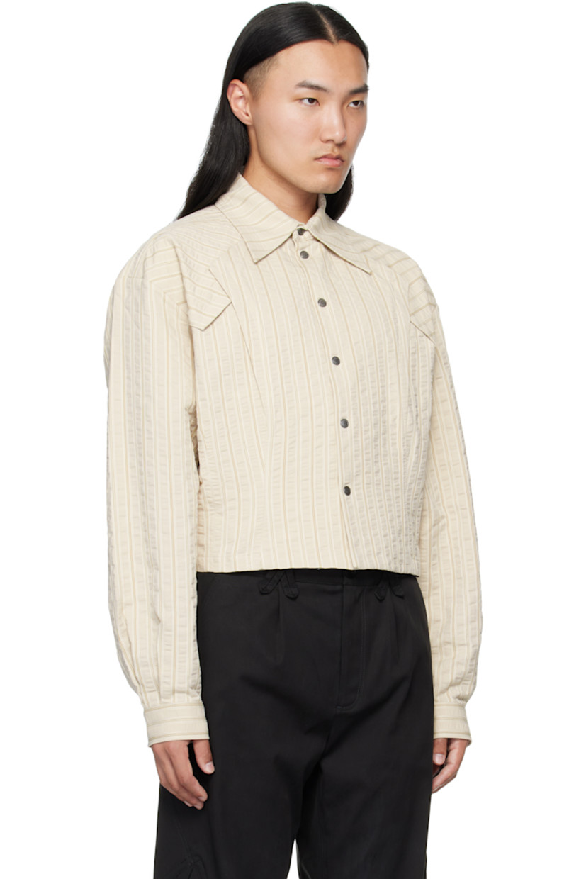 Woven cotton shirt.

· Woven stripes throughout
· Spread collar
· Press-stud closure 
· Overlayed panels at front
· Cropped hem
· Adjustable press-stud cuffs

Supplier color: Ivory Hunter Stripe