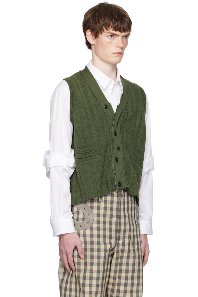 Rib-knit virgin wool-blend vest. 

· Y-neck
· Zip closure with button placket
· Welt pockets at front
· Scalloped edge at cropped hem

Supplier color: Juniper green