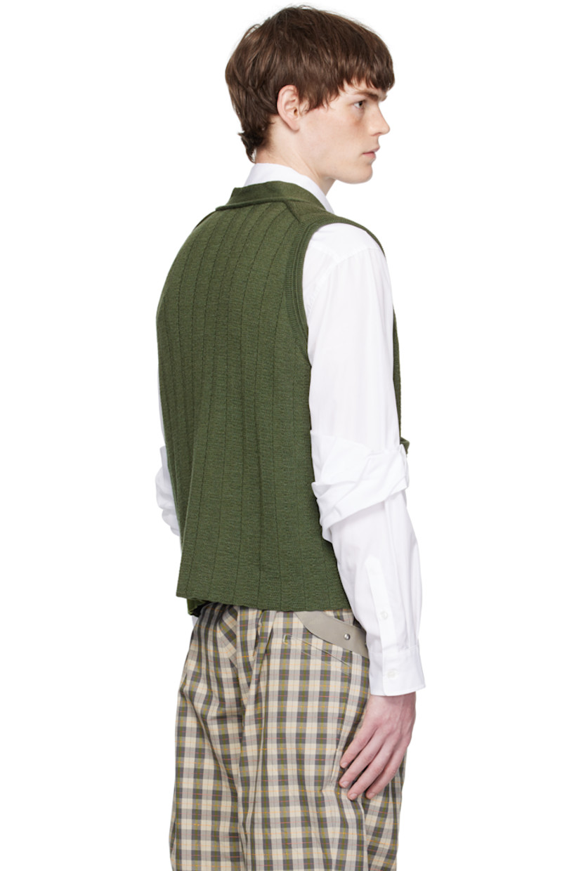 Rib-knit virgin wool-blend vest. 

· Y-neck
· Zip closure with button placket
· Welt pockets at front
· Scalloped edge at cropped hem

Supplier color: Juniper green