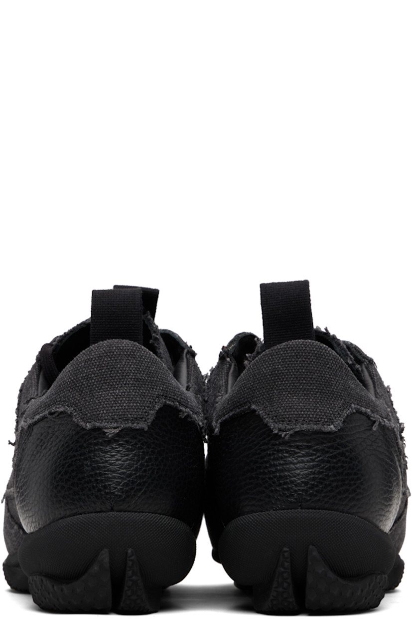 Low-top cotton canvas sneakers.

· Raw edges and fading throughout
· Lace-up closure
· Pull-loop with logo hardware at tongue
· Padded tongue and collar
· Pull-loop at heel collar
· Buffed leather lining
· Treaded rubber sole

Supplier color: Carbon black