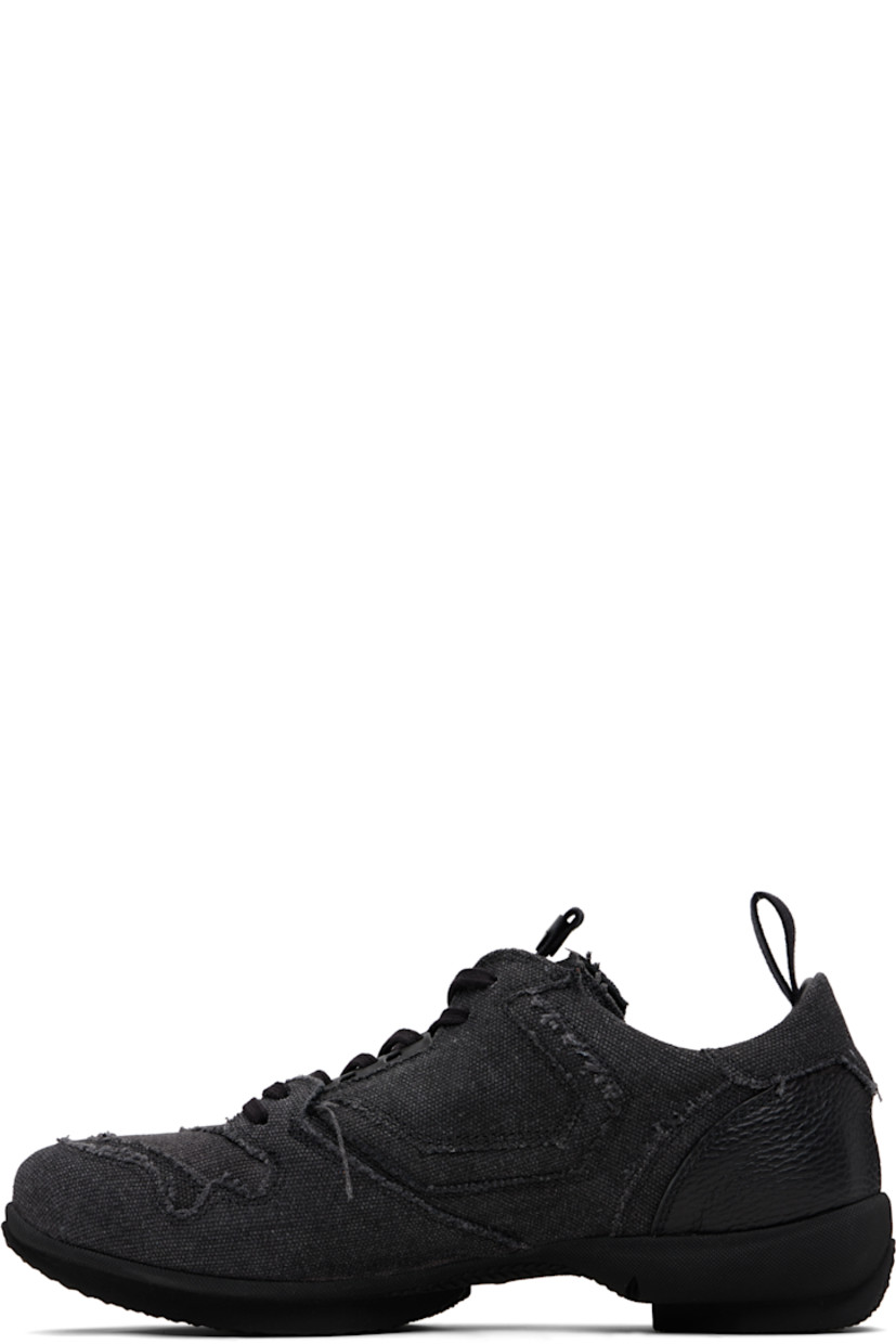 Low-top cotton canvas sneakers.

· Raw edges and fading throughout
· Lace-up closure
· Pull-loop with logo hardware at tongue
· Padded tongue and collar
· Pull-loop at heel collar
· Buffed leather lining
· Treaded rubber sole

Supplier color: Carbon black