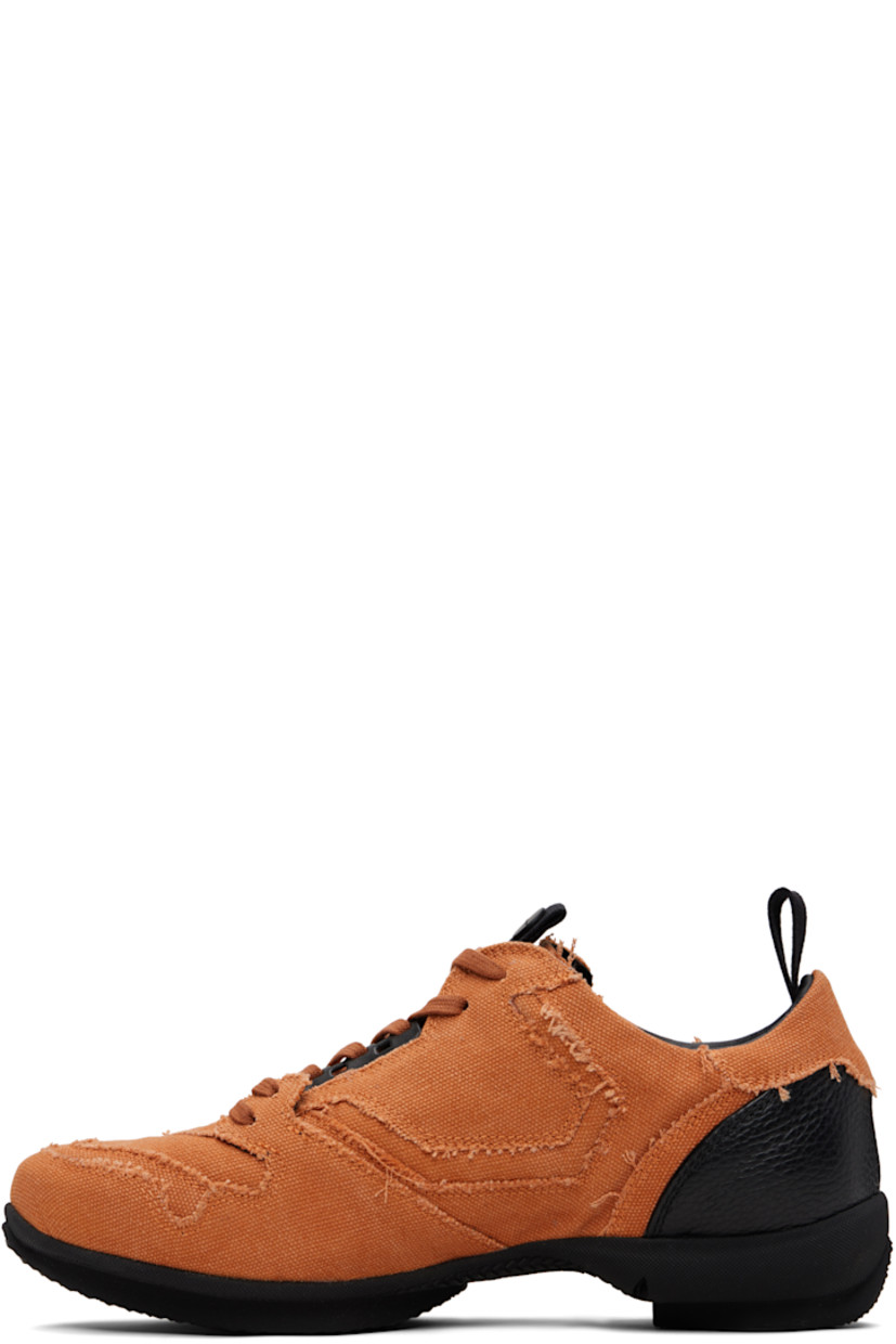 Low-top cotton canvas sneakers.

· Raw edges and fading throughout
· Lace-up closure
· Pull-loop with logo hardware at tongue
· Padded tongue and collar
· Pull-loop at heel collar
· Buffed leather lining
· Treaded rubber sole

Supplier color: Beech orange