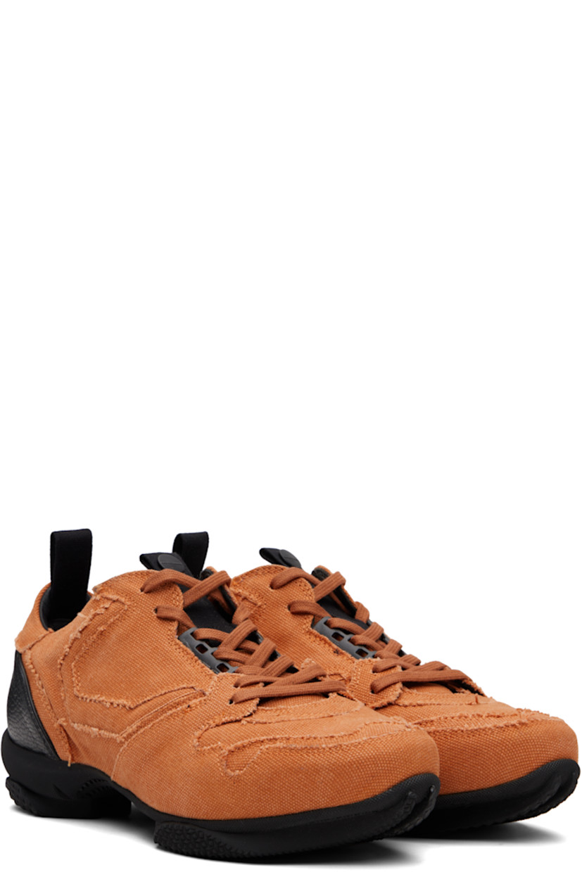 Low-top cotton canvas sneakers.

· Raw edges and fading throughout
· Lace-up closure
· Pull-loop with logo hardware at tongue
· Padded tongue and collar
· Pull-loop at heel collar
· Buffed leather lining
· Treaded rubber sole

Supplier color: Beech orange