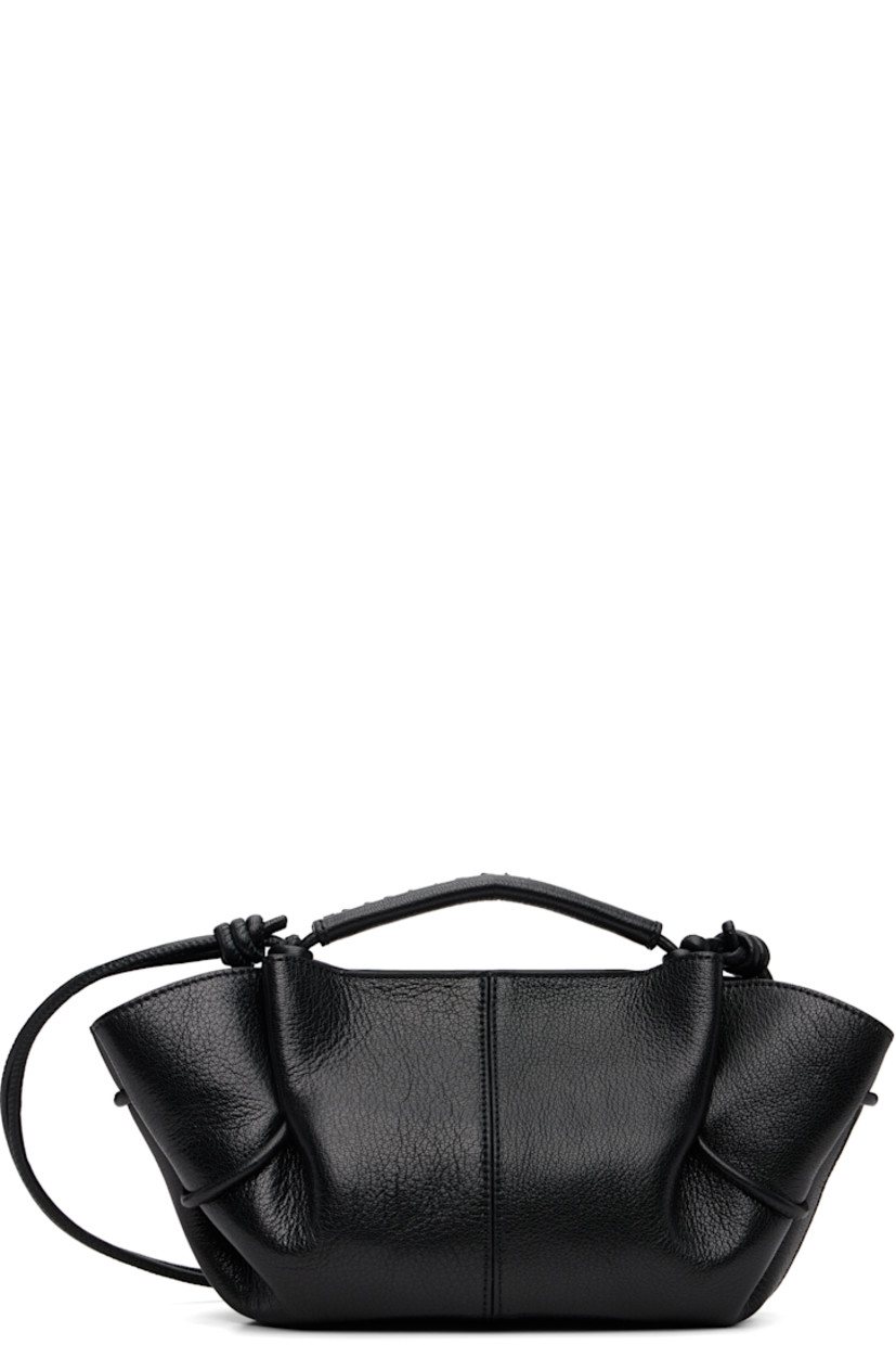 Grained lambskin top handle bag. 

· Whipstitching at rolled carry handle
· Knotted adjustable crossbody strap
· Pleats at sides
· Magnetic closure
· Goatskin lining
· H5.5" x W12" x D4"

Supplier color: Black