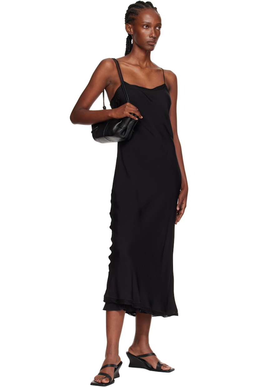 Grained lambskin top handle bag. 

· Whipstitching at rolled carry handle
· Knotted adjustable crossbody strap
· Pleats at sides
· Magnetic closure
· Goatskin lining
· H5.5" x W12" x D4"

Supplier color: Black