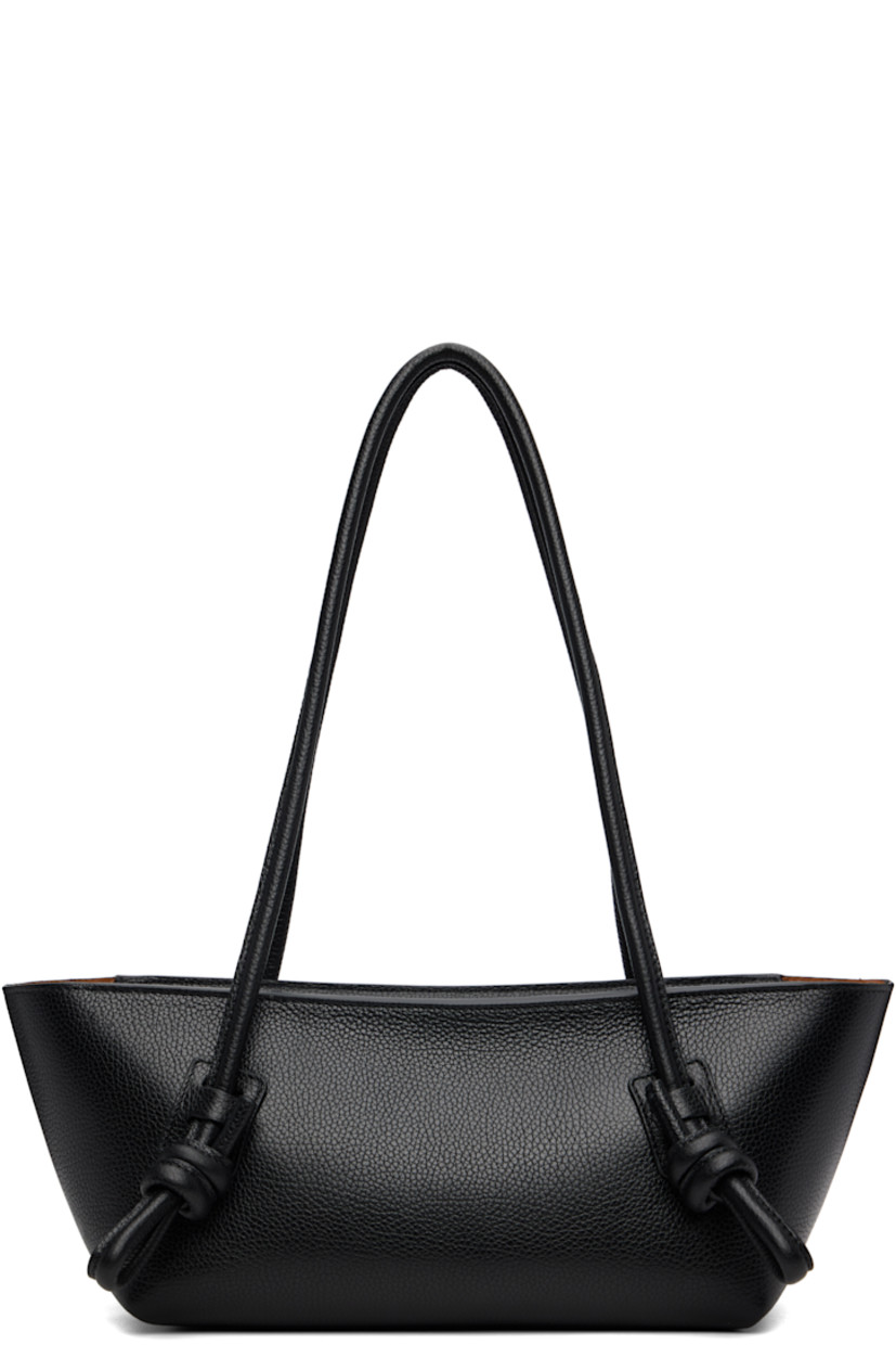 Handcrafted pebble-grained calfskin shoulder bag.

· Knotted detailing at fixed shoulder straps
· Zip closure
· Card slot at interior 
· Unlined
· Antiqued silver-tone hardware
· H5.5" x W16" x D5"

Supplier color: Black