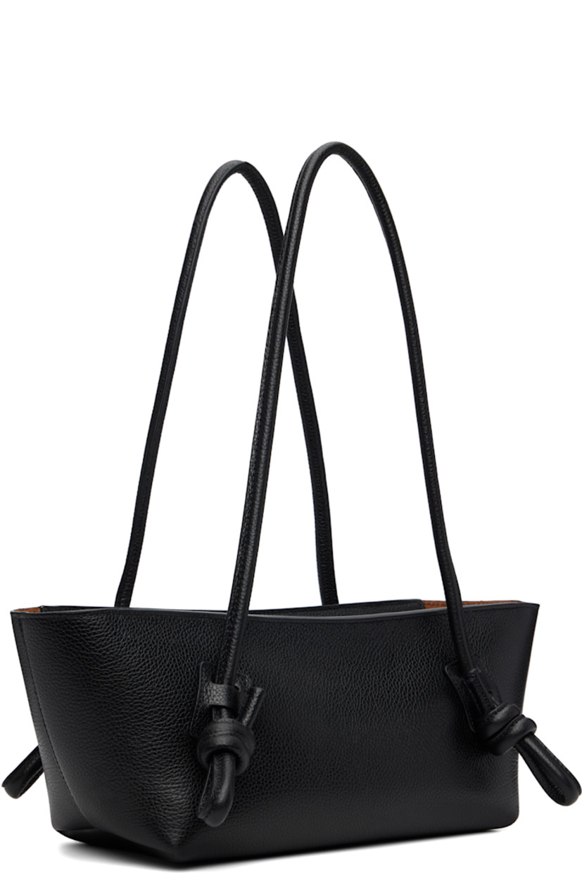 Handcrafted pebble-grained calfskin shoulder bag.

· Knotted detailing at fixed shoulder straps
· Zip closure
· Card slot at interior 
· Unlined
· Antiqued silver-tone hardware
· H5.5" x W16" x D5"

Supplier color: Black