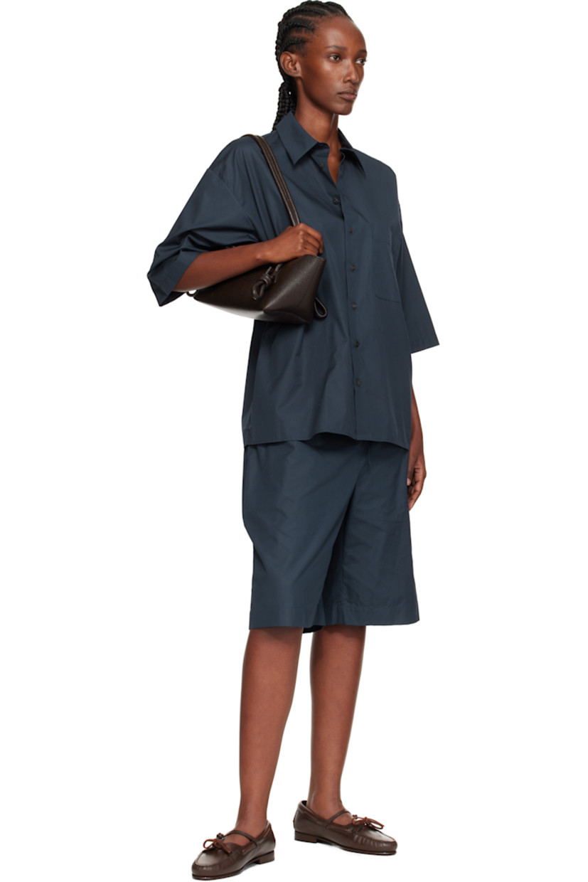 Handcrafted pebble-grained calfskin shoulder bag.

· Knotted detailing at fixed shoulder straps
· Zip closure
· Card slot at interior 
· Unlined
· Antiqued silver-tone hardware
· H5.5" x W16" x D5"
 
Supplier color: Dark brown