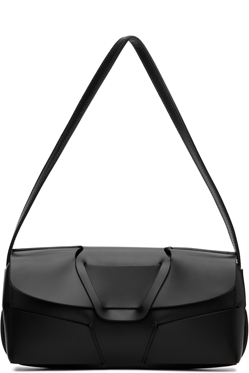 Polished calfskin shoulder bag.

· Fixed shoulder strap
· Magnetic flap
· Patch pocket at interior
· Calfskin suede lining
· H5" x W10" x D2"

Supplier color: Black