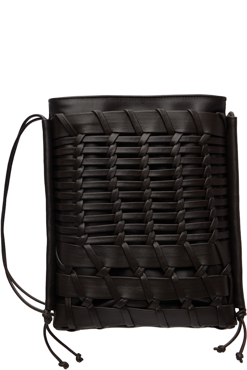 Buffed calfskin shoulder bag.

·� Adjustable crossbody strap
· Hand-woven patch pocket at face
· Magnetic closure
· Patch pocket at interior
· Organic cotton canvas lining
· H9" x W7.25" x D1"

Supplier color: Dark brown