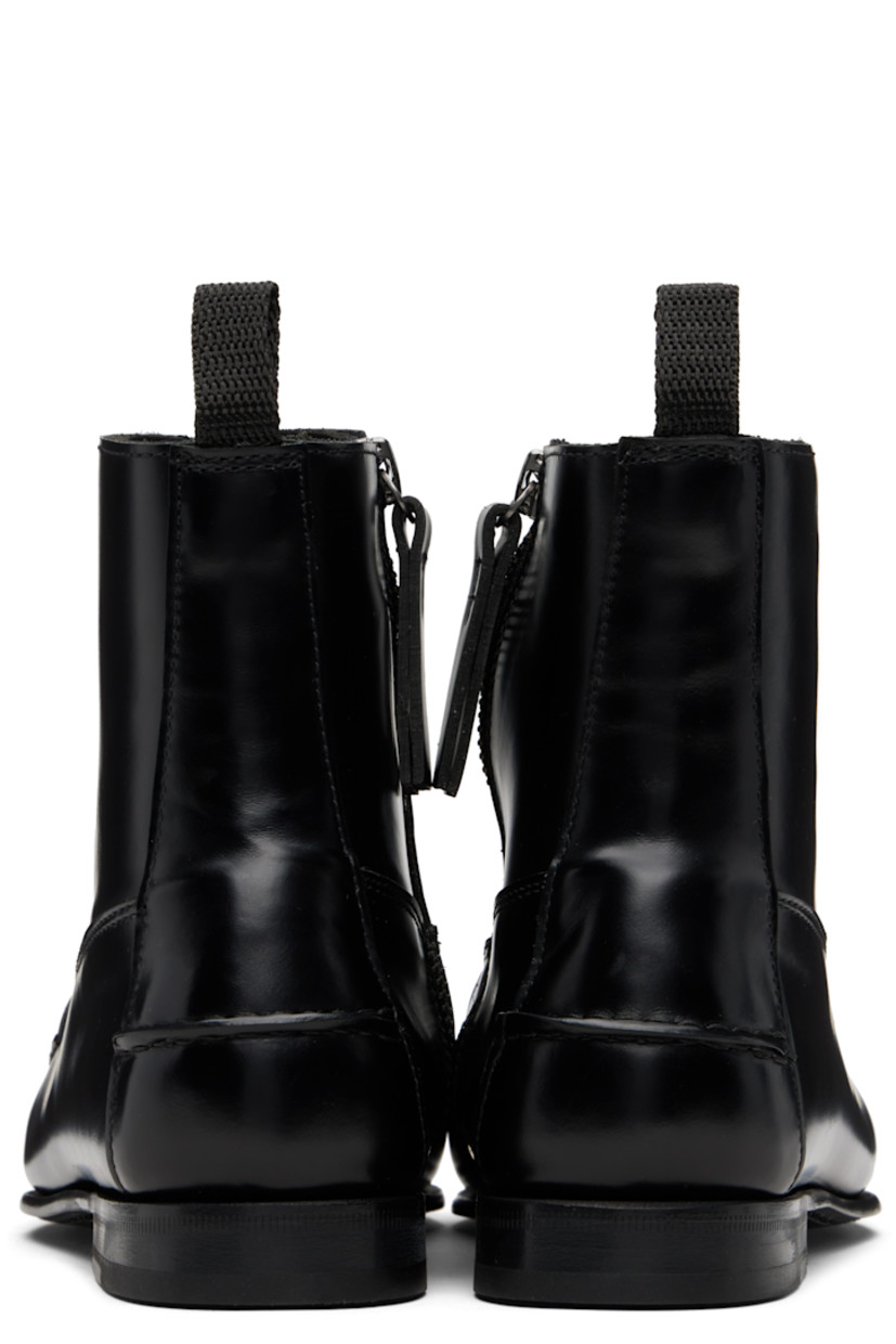 Handcrafted ankle-high buffed leather boots.

· Moc toe
· Basket-woven strap at vamp
· Zip closure at inner side
· Webbing pull-loop at heel collar
· Pinched seam at heel counter
· Stacked leather heel
· Leather sole

Supplier color: Black