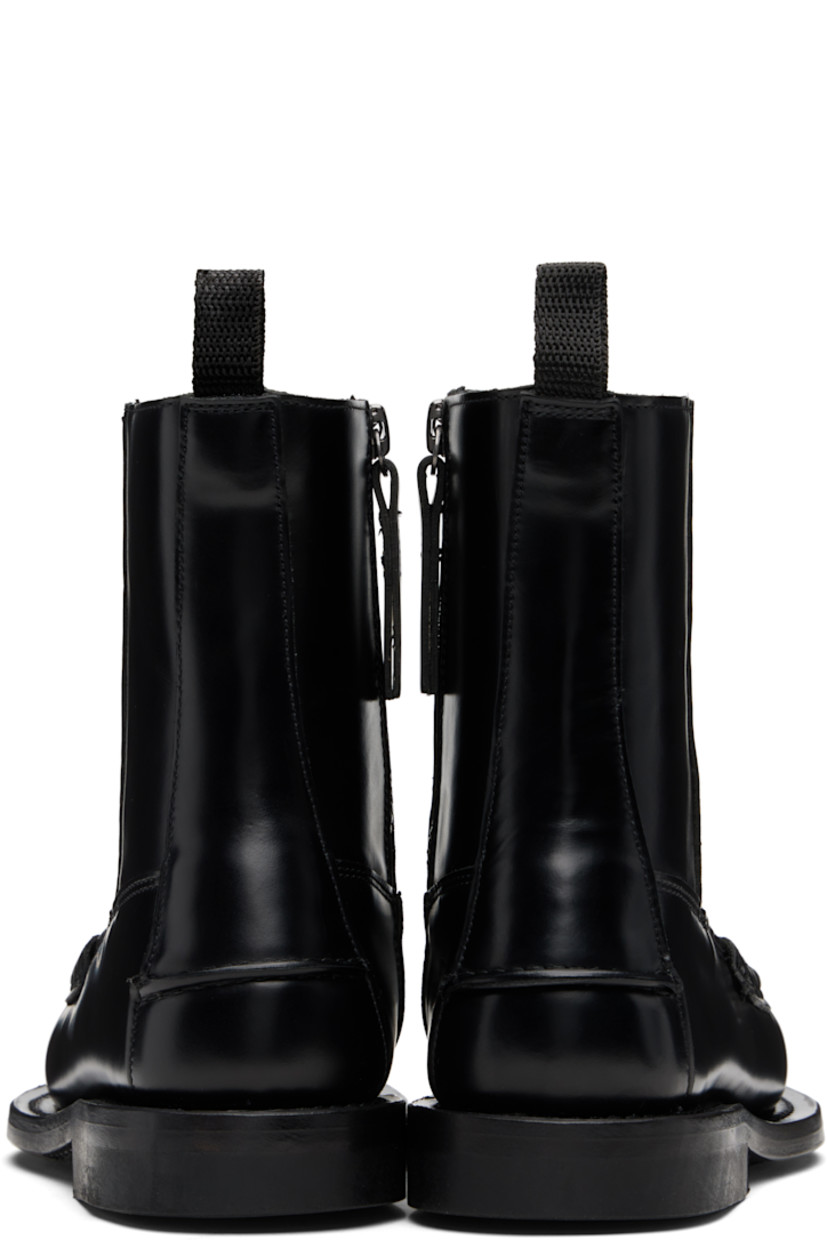 Handcrafted ankle-high buffed calfskin boots.

· Paneled construction
· Moc toe
· Zip closure at inner side
· Webbing pull-loop at heel collar
· Pinched seam at heel counter
· Stacked calfskin heel
· Calfskin sole

Supplier color: Black