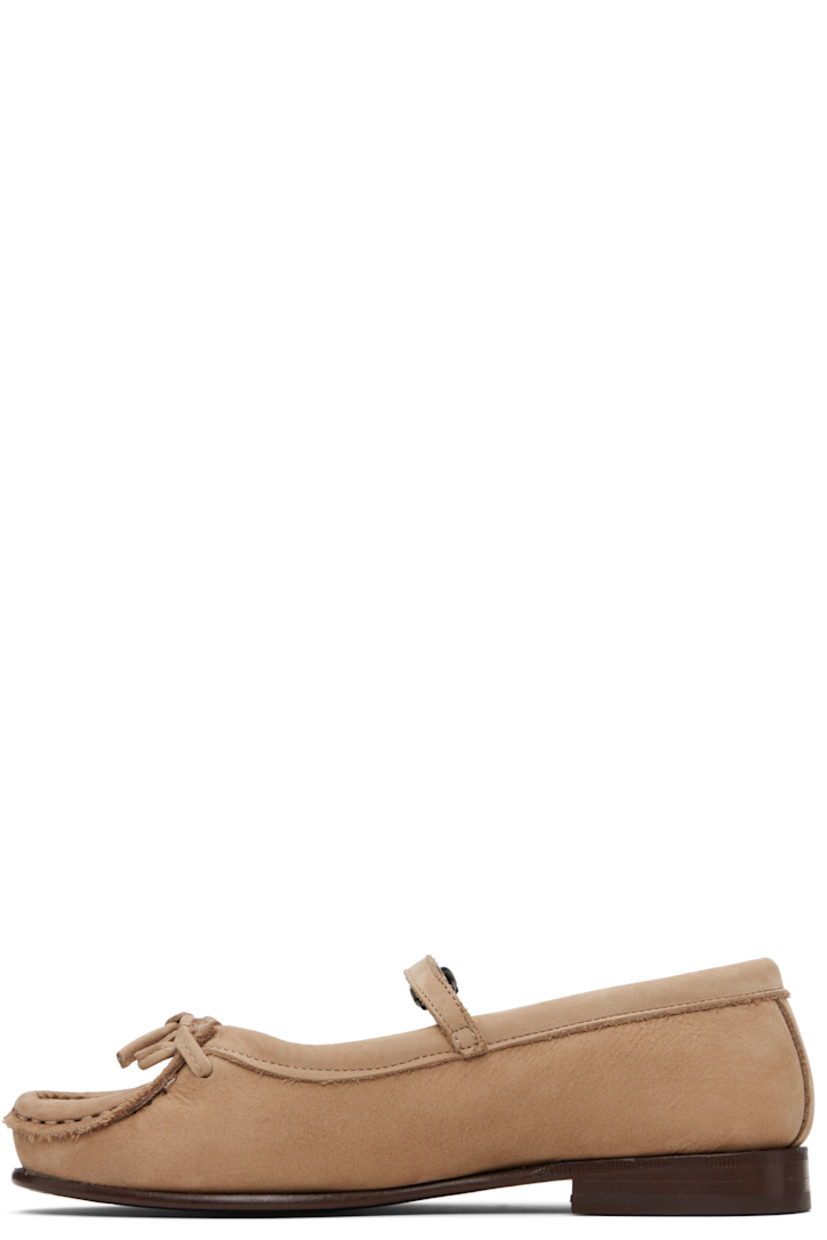 Calfskin nubuck flats.

· Moc toe
· Bow at vamp
· Mary Jane-style pin-buckle strap
· Buffed leather lining
· Stacked leather heel with rubber injection
· Calfskin sole

Supplier color: Caramel