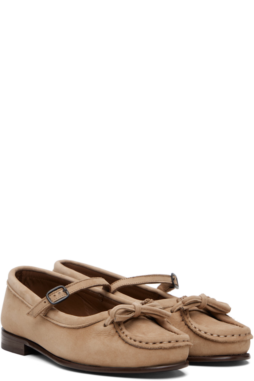 Calfskin nubuck flats.

· Moc toe
· Bow at vamp
· Mary Jane-style pin-buckle strap
· Buffed leather lining
· Stacked leather heel with rubber injection
· Calfskin sole

Supplier color: Caramel